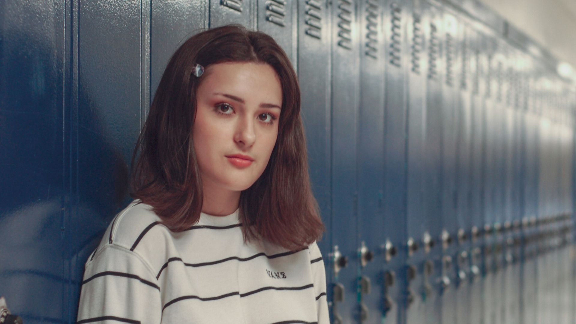 woman leaning against locker