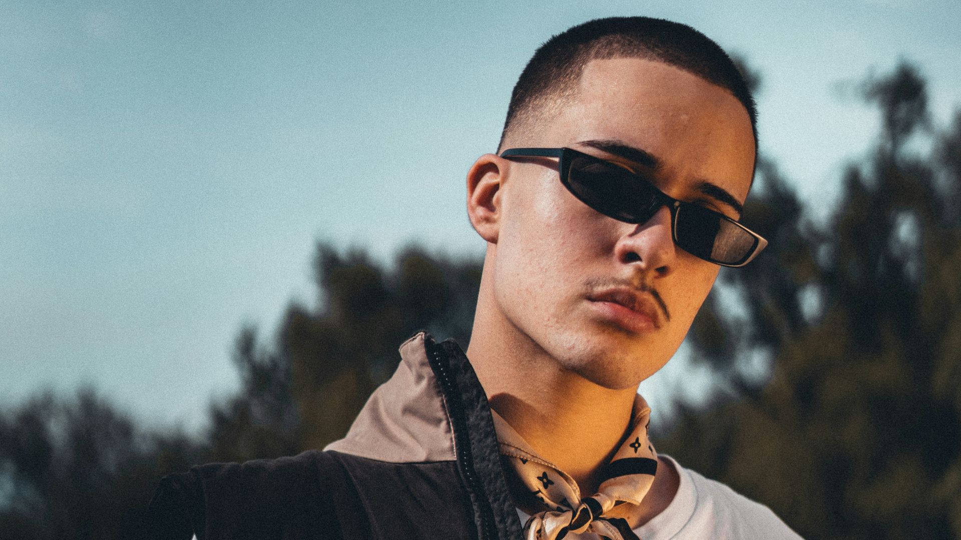 man in white button up shirt wearing black sunglasses