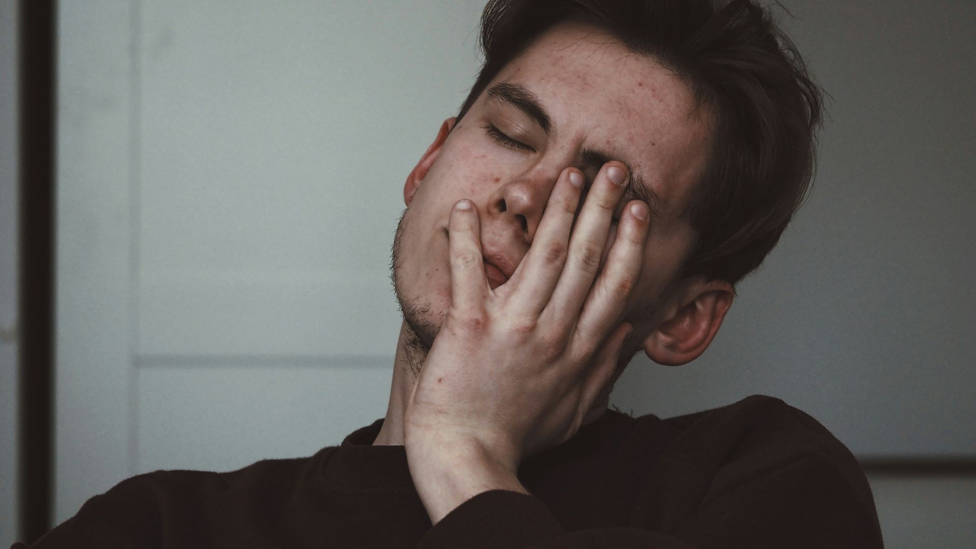 man wearing black crew-neck top
