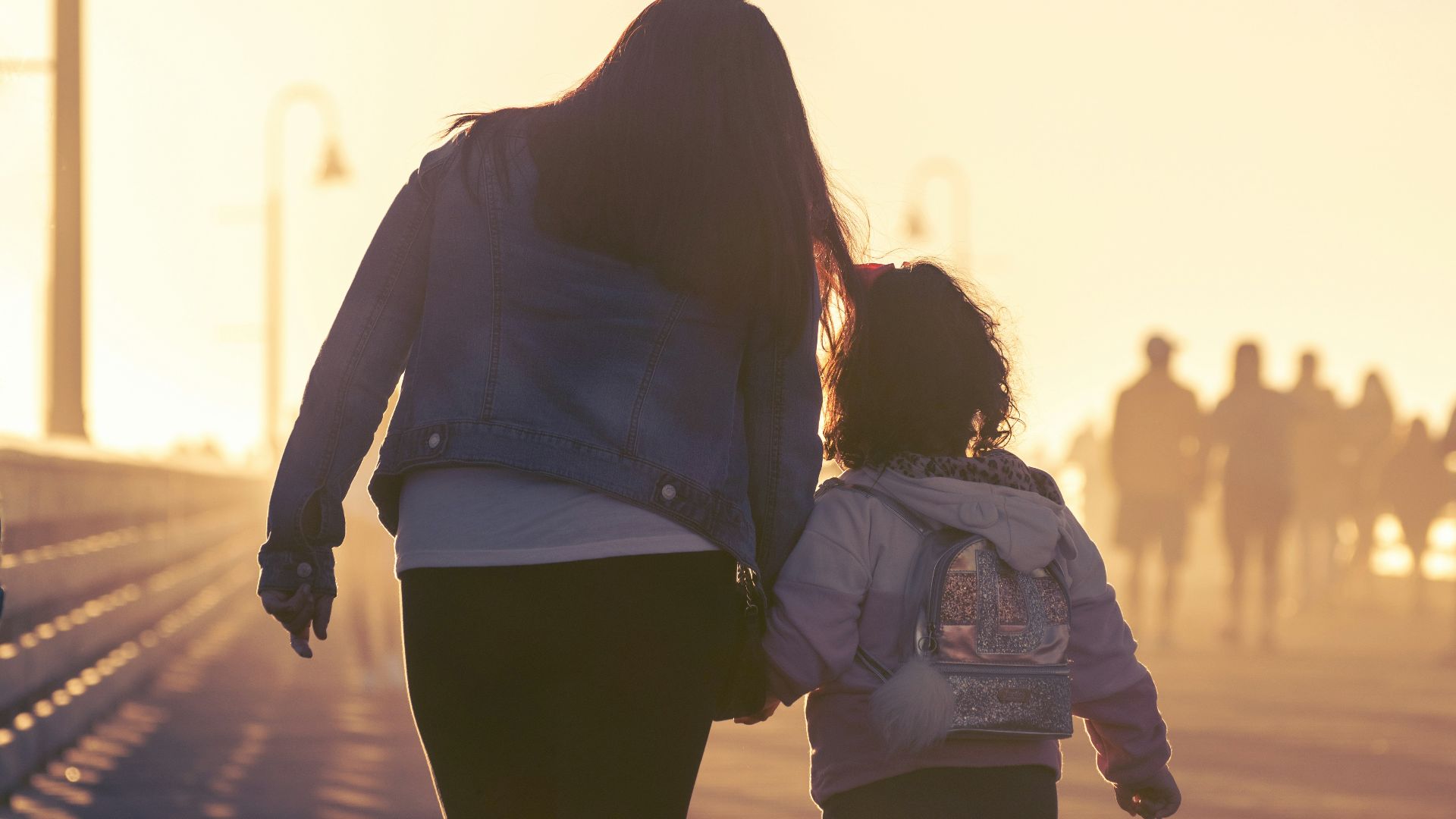 2 women walking on the road during daytime