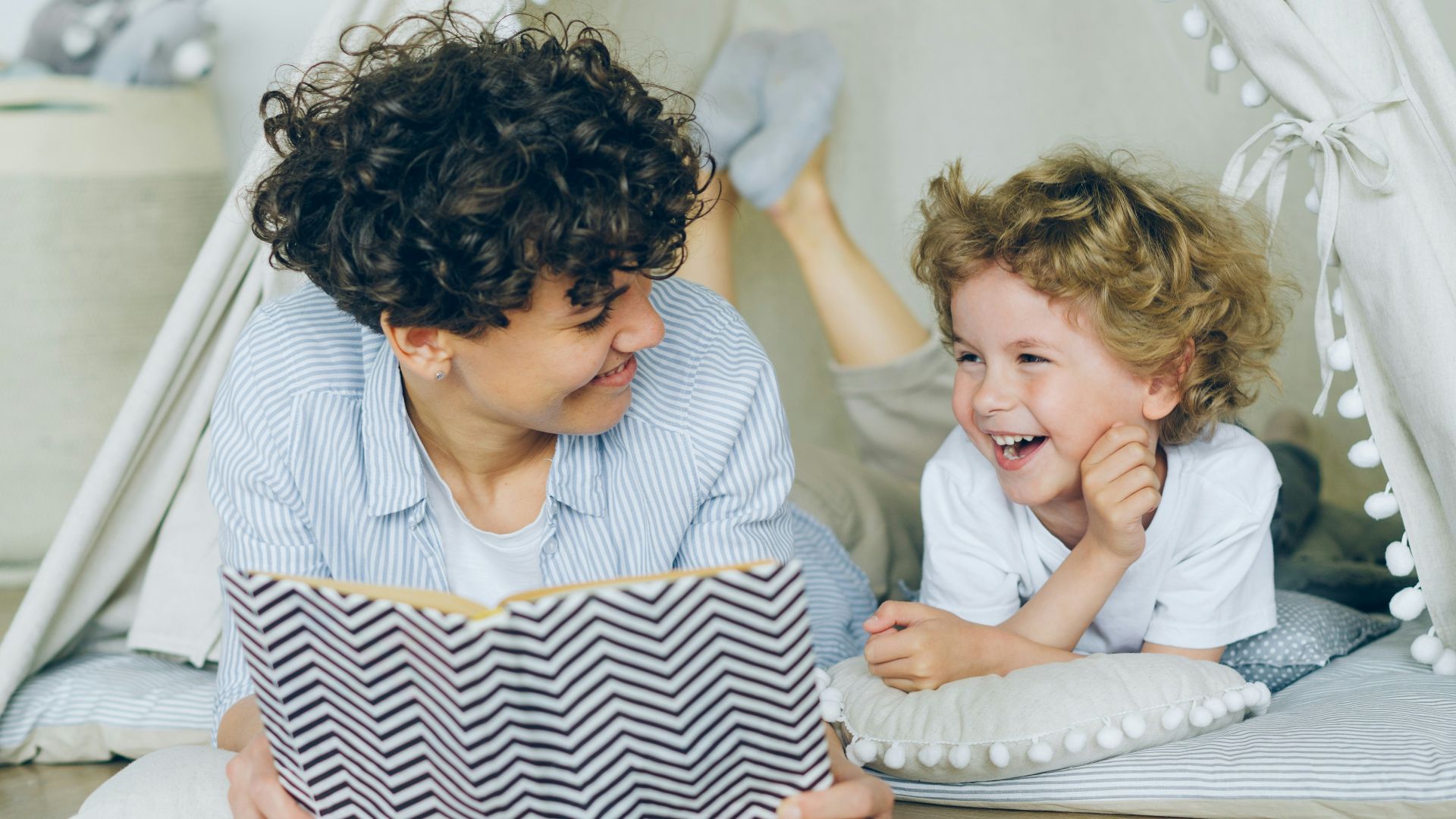 a woman reading a book to a child