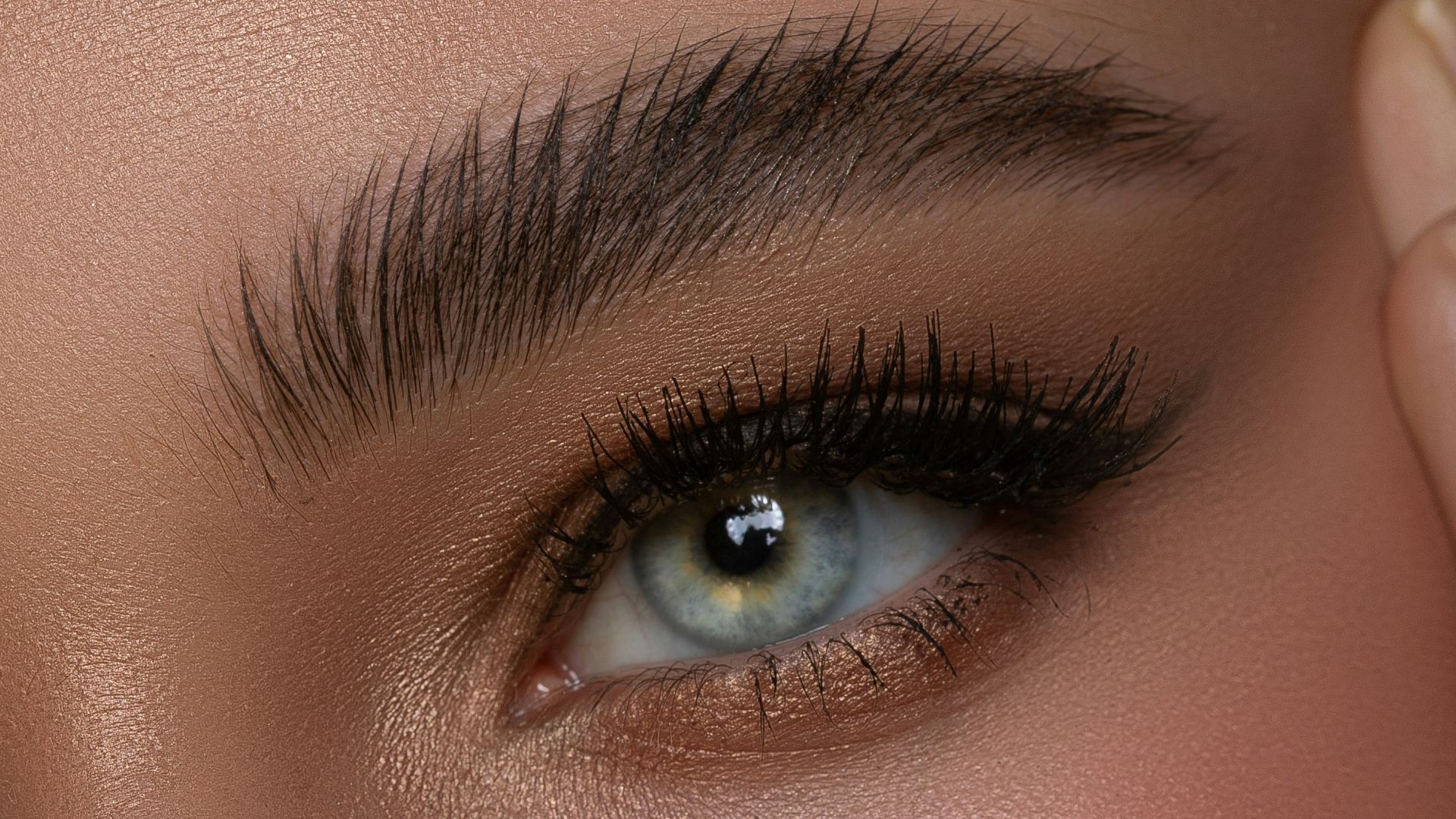 a close up of a woman with blue eyes