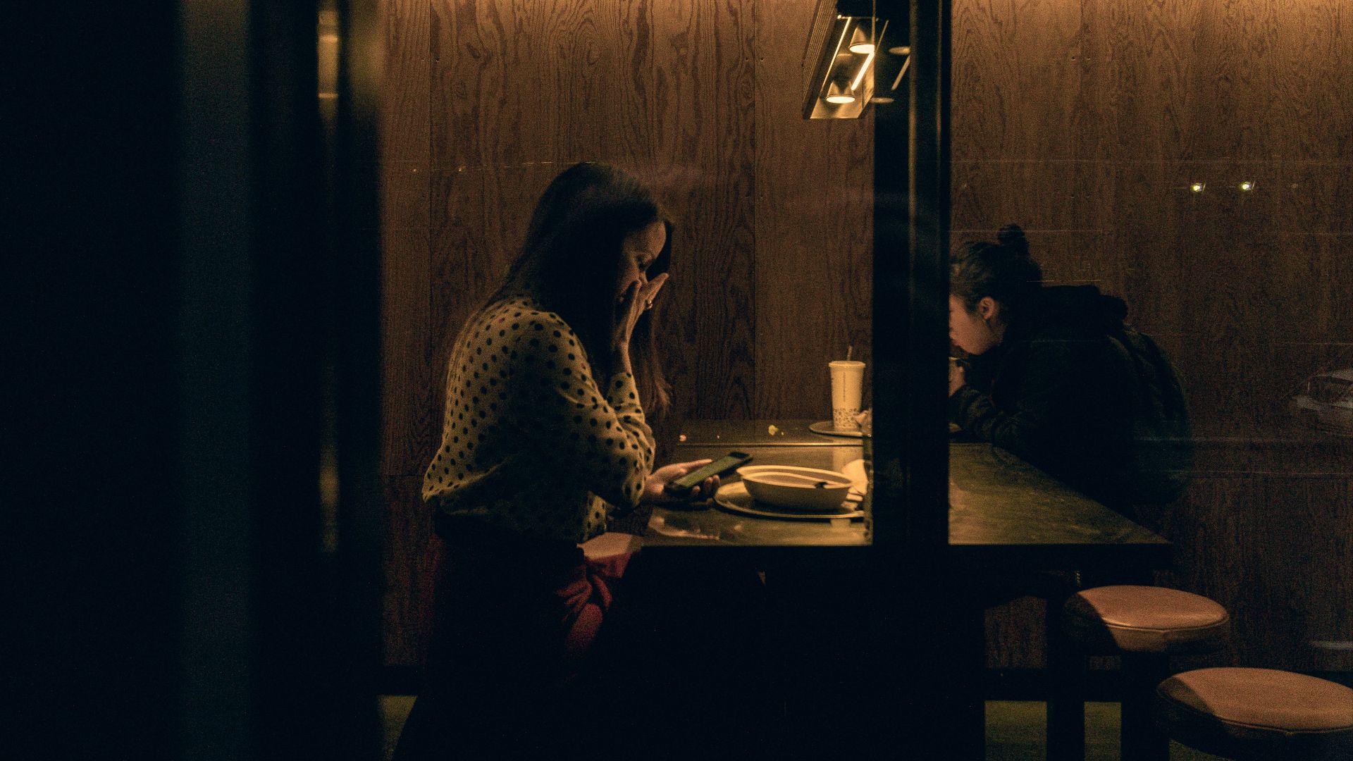 woman and man sitting on chair near table