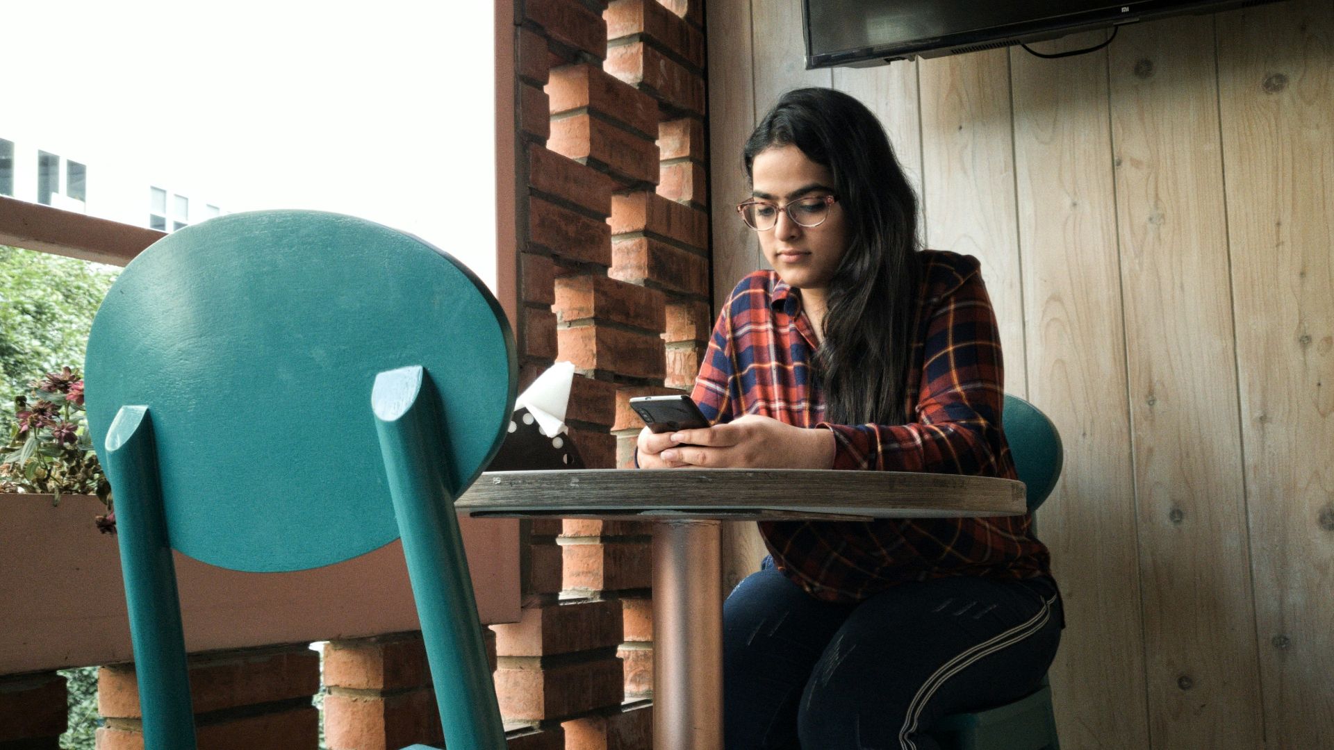 woman leaning on pedestal table