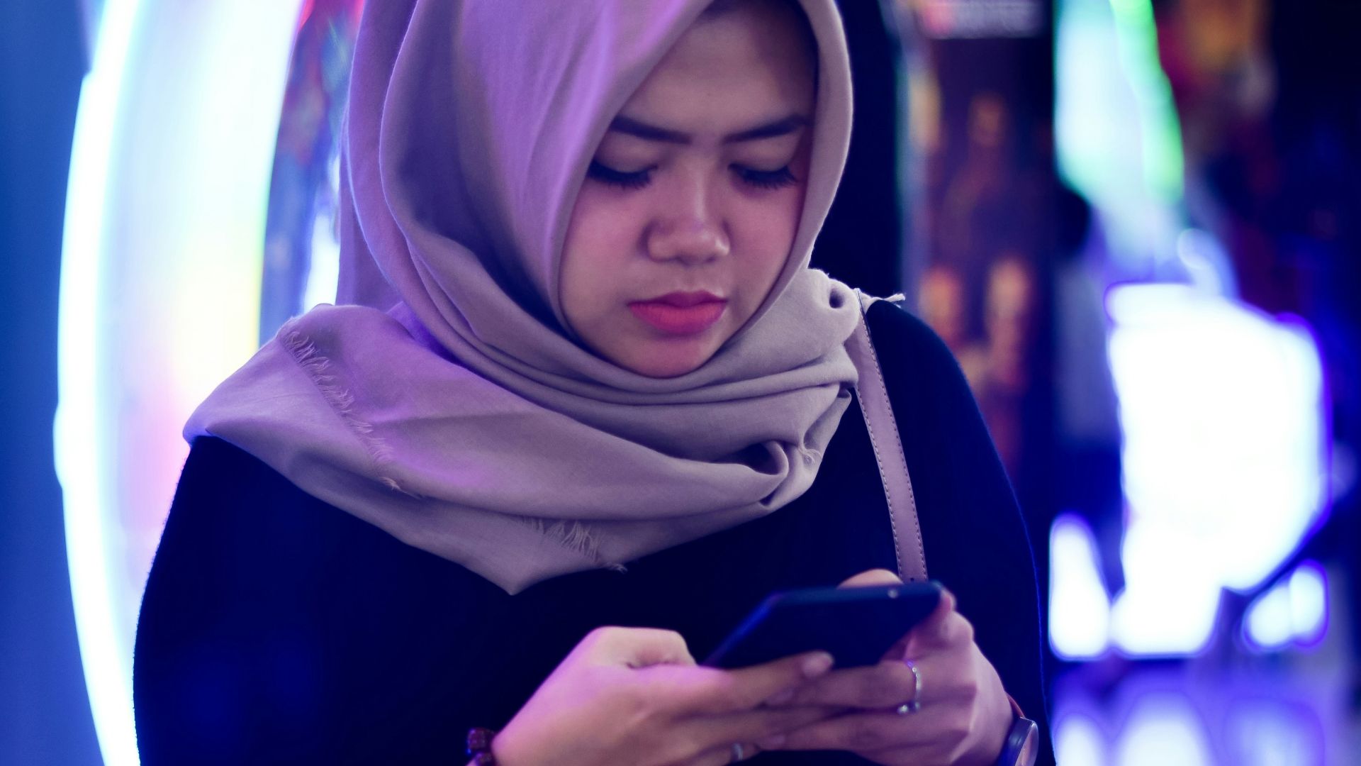 woman looking at own phone