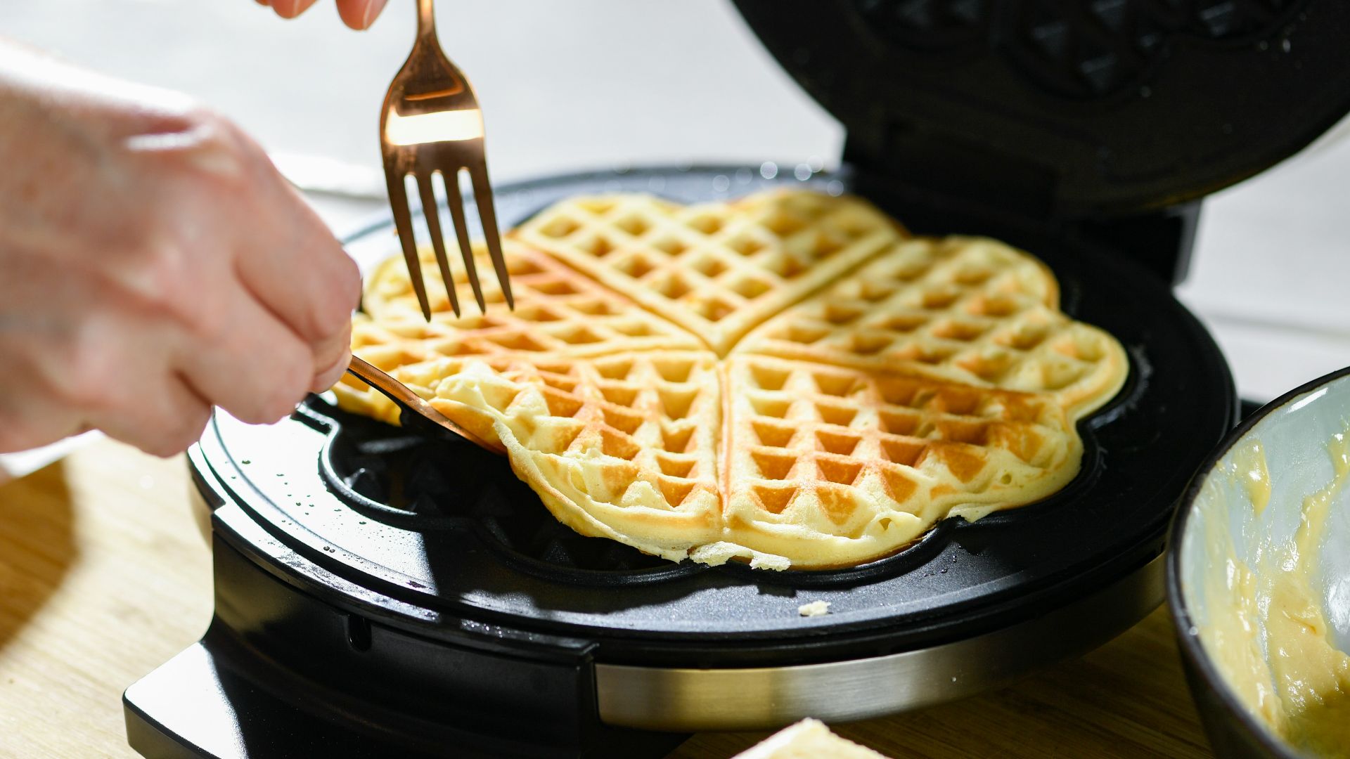 waffle on black pan with white cream
