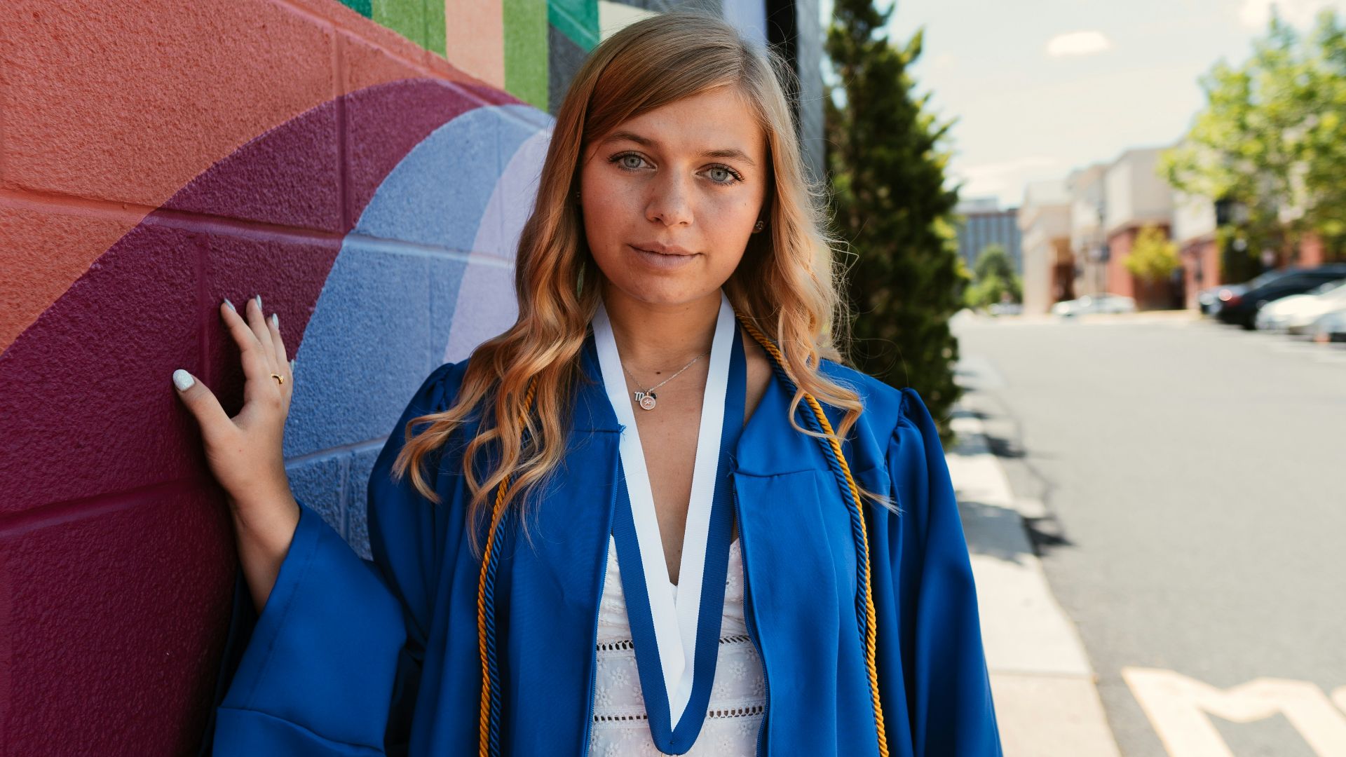 woman in blue and white academic dress