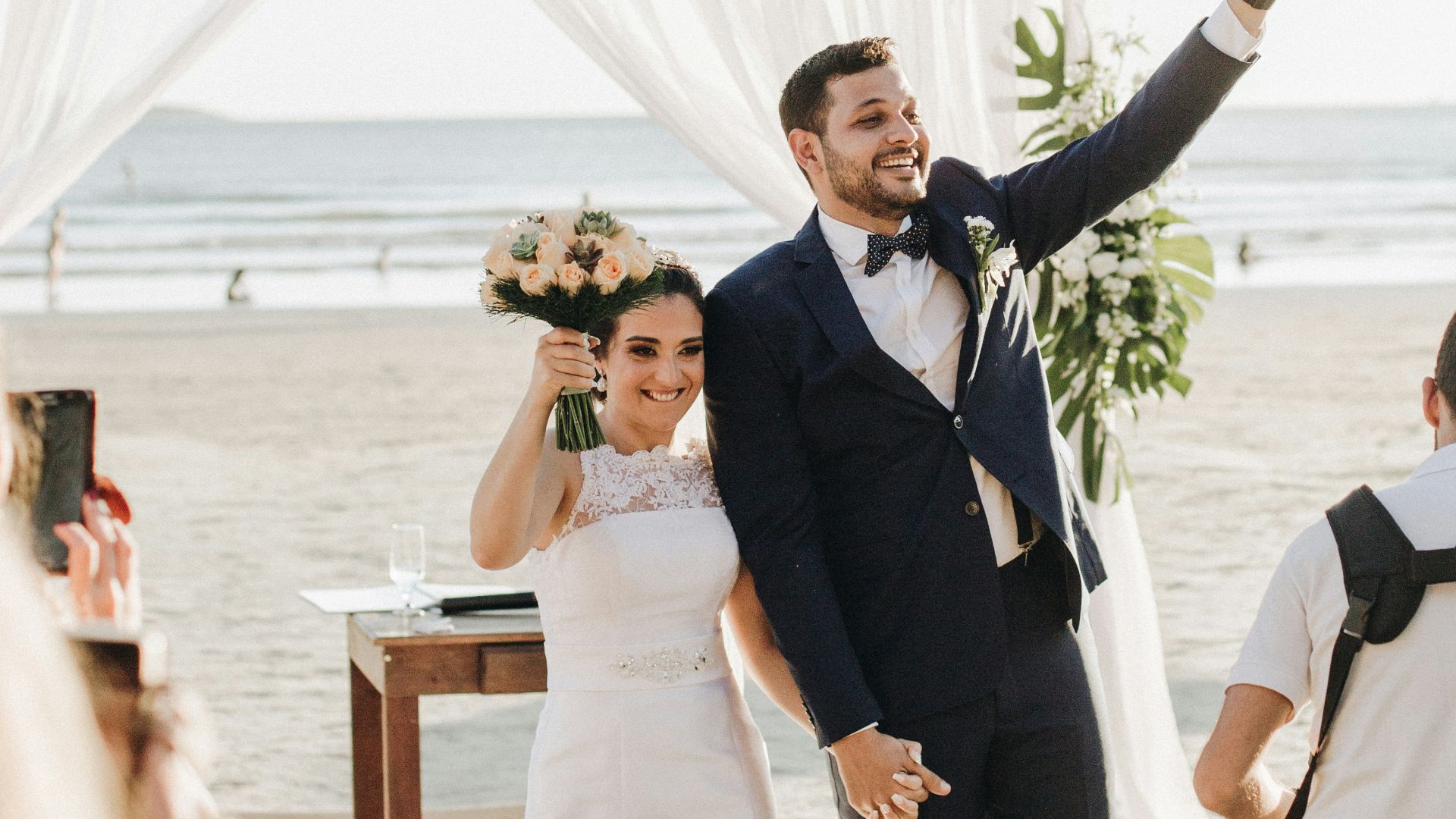 newly wed couple at shore during daytime