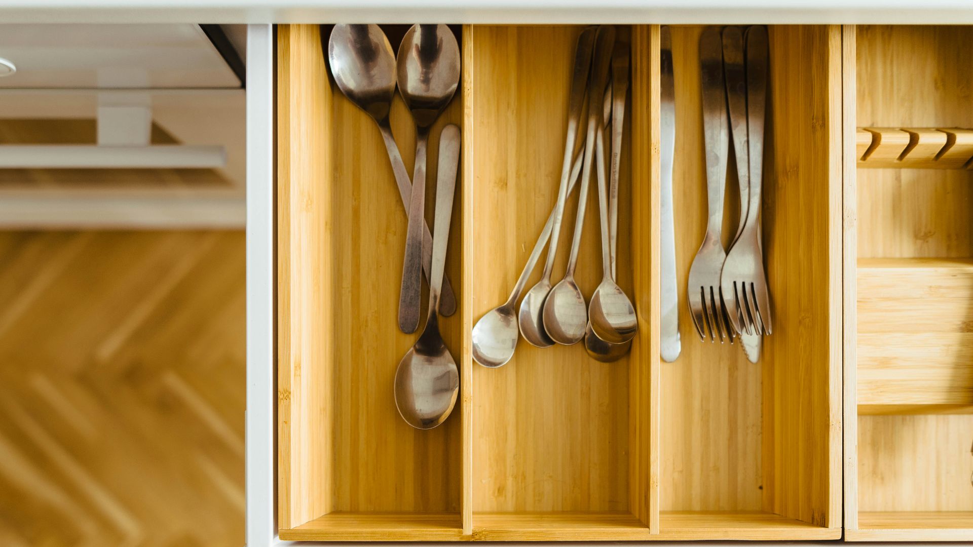 silver utensils in drawer