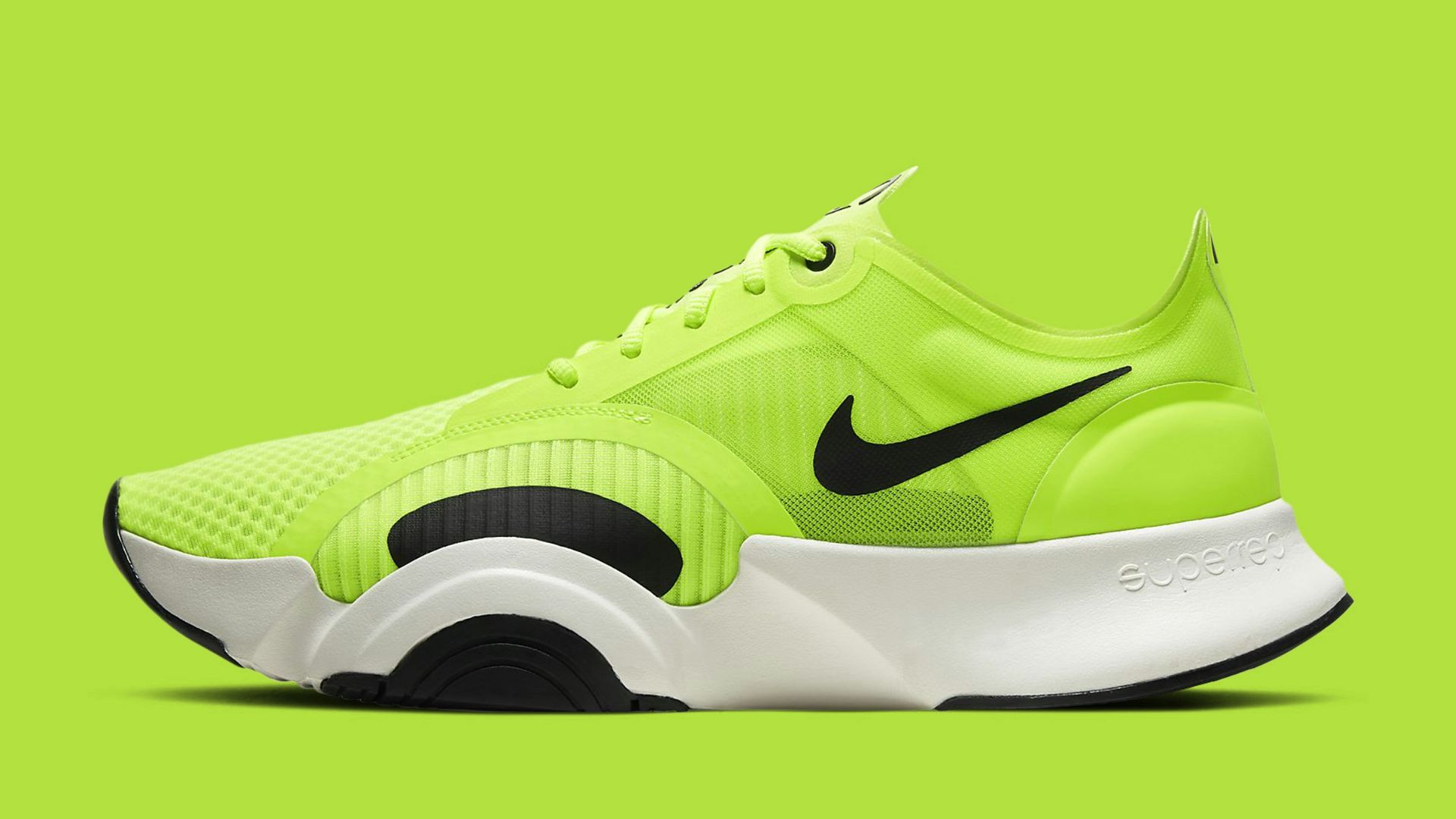 green and black nike athletic shoe