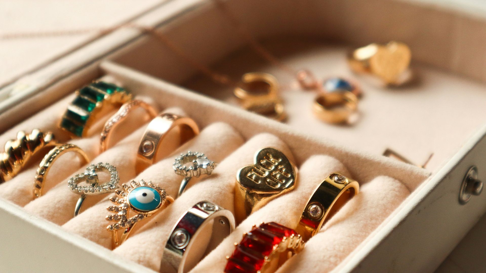 a box filled with lots of different types of rings