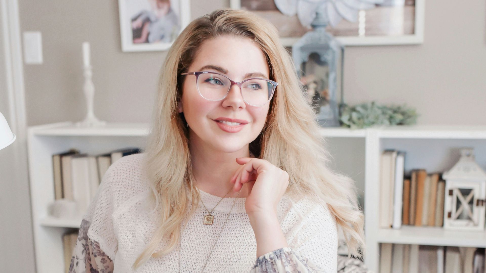 woman in white lace long sleeve shirt using silver macbook