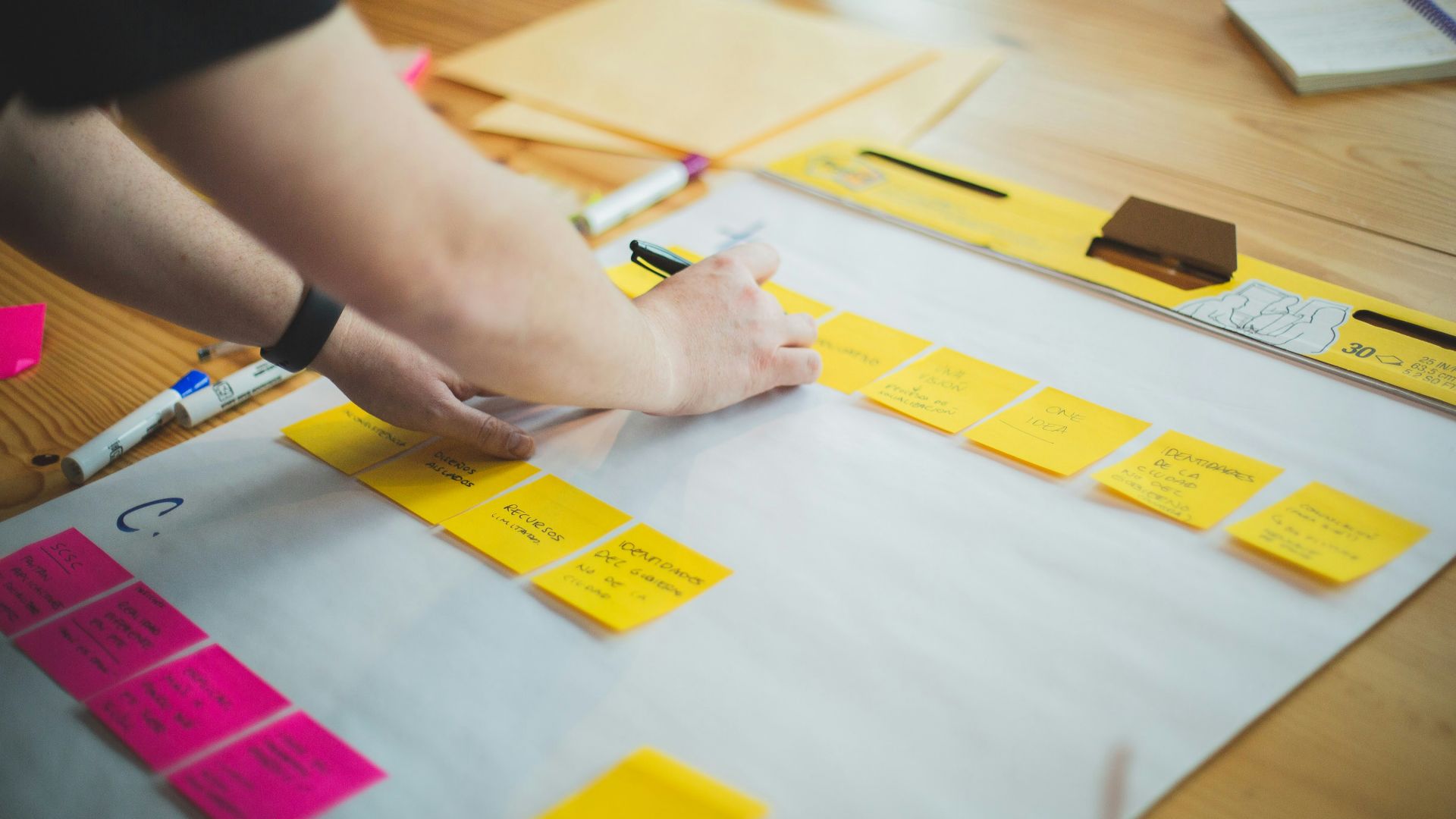 person writing on white paper