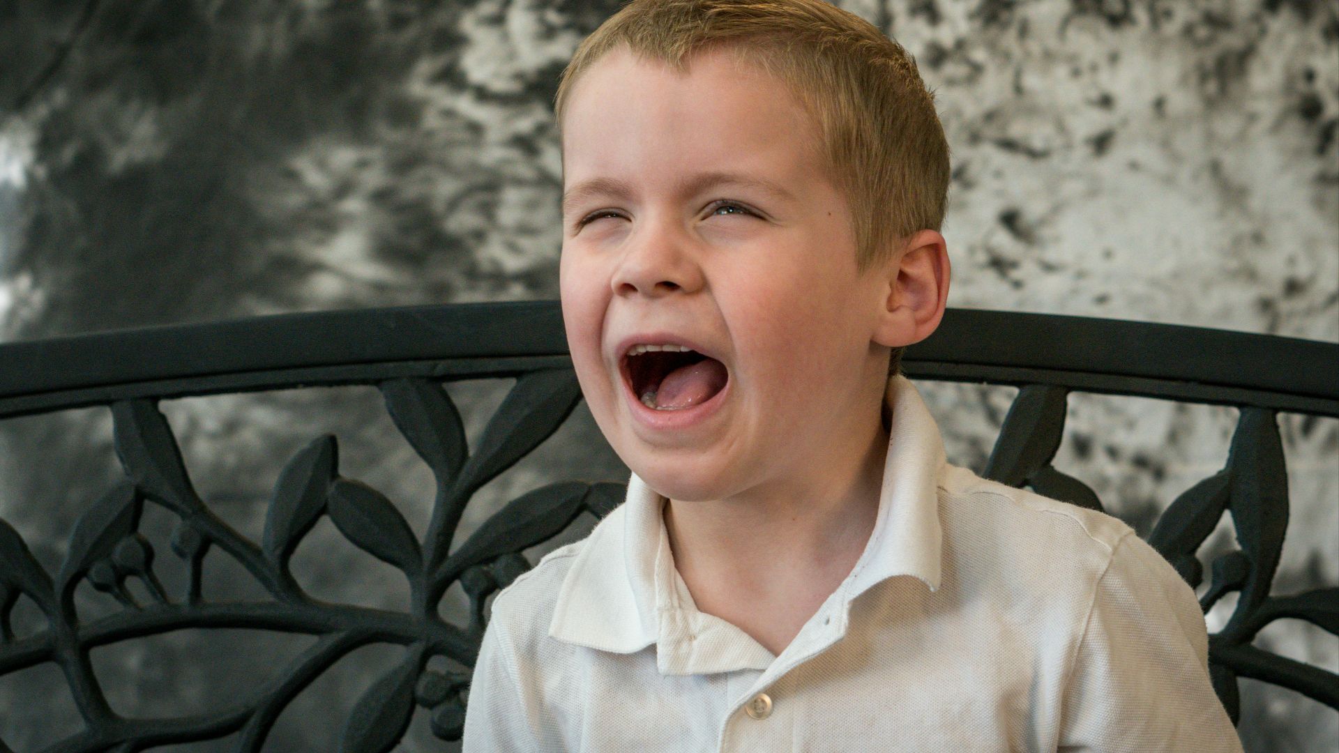 shallow focus photo of boy in white button-up shirt