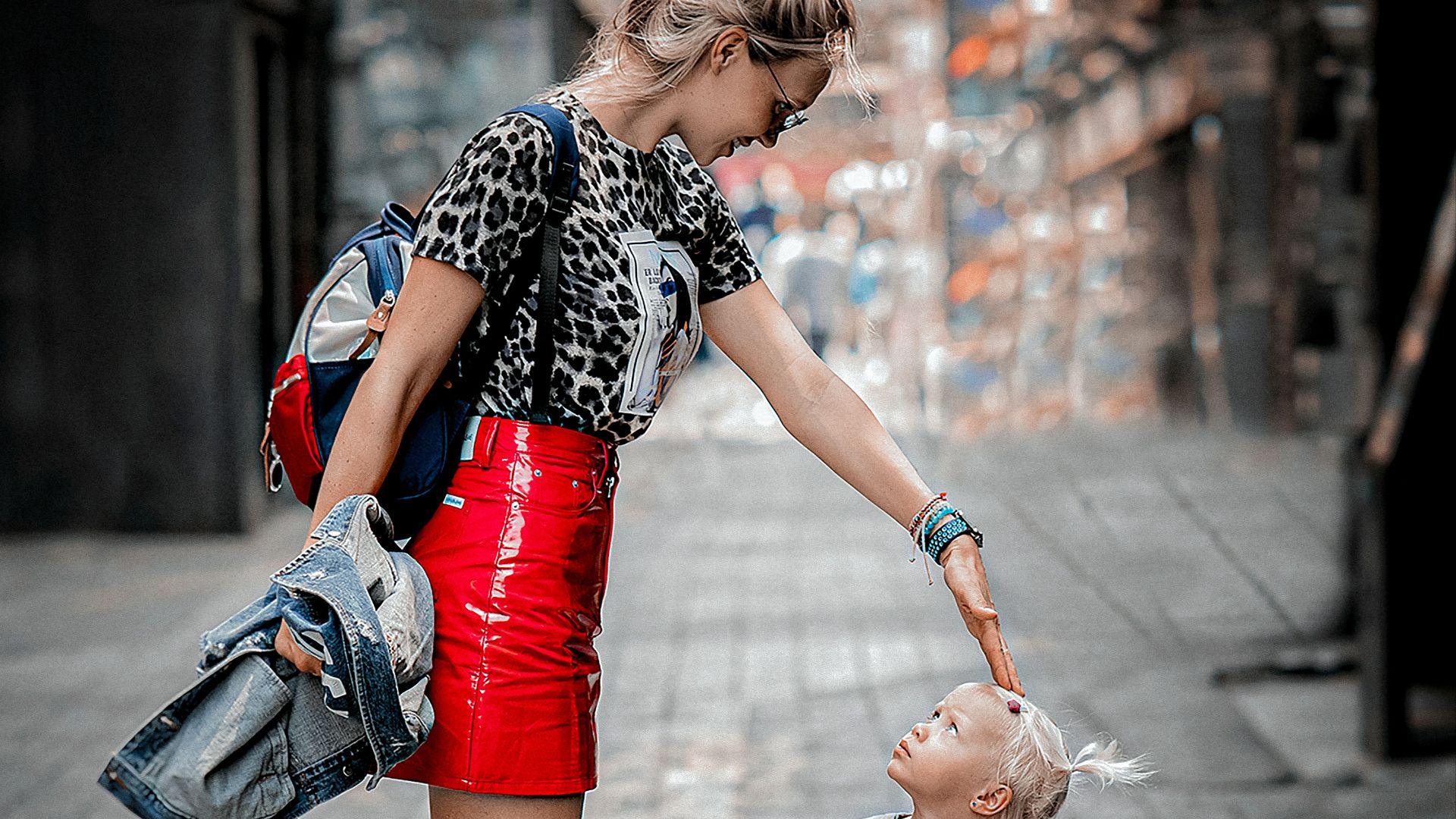 a woman walking with a little girl