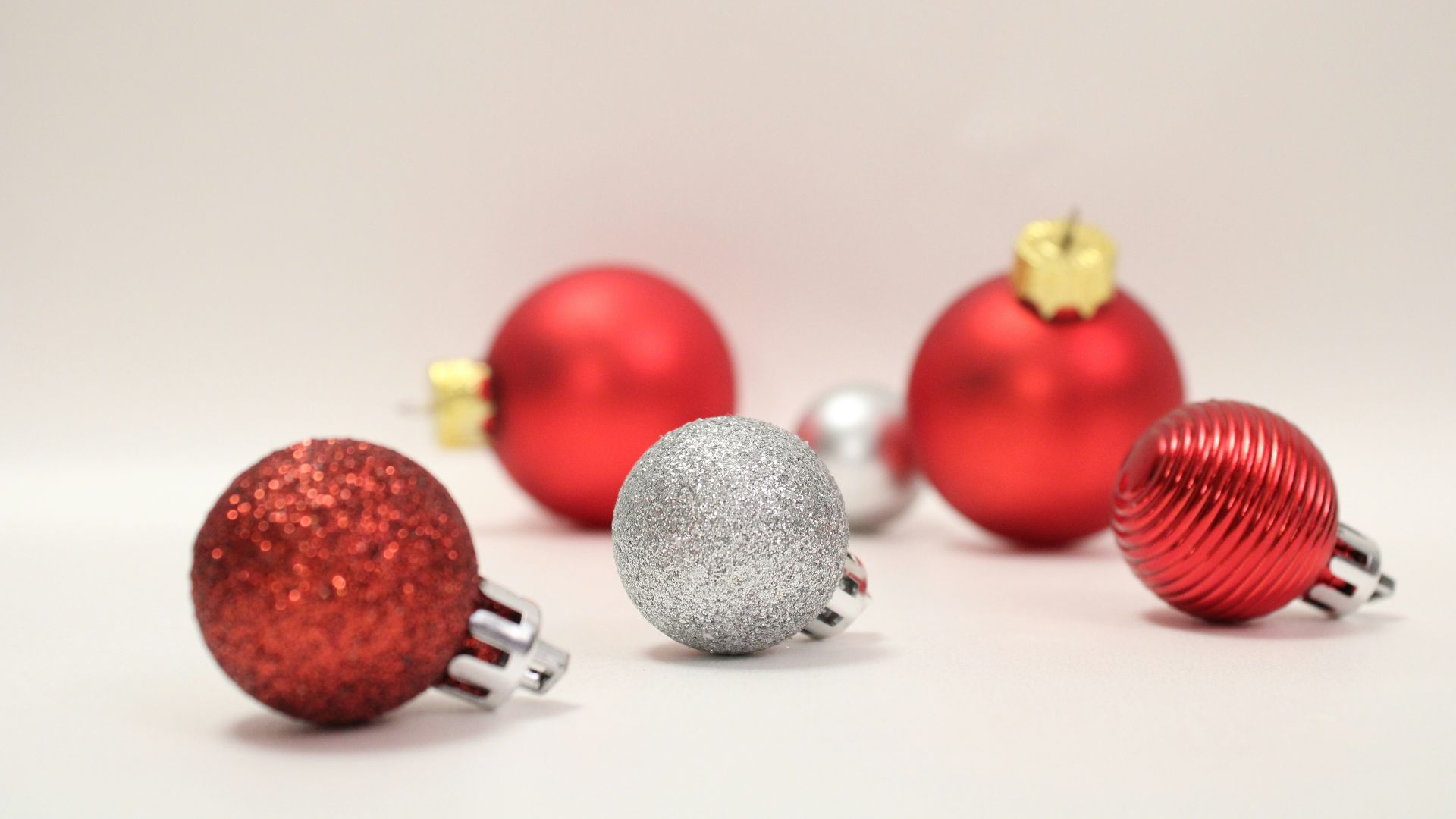 a group of red and silver christmas ornaments