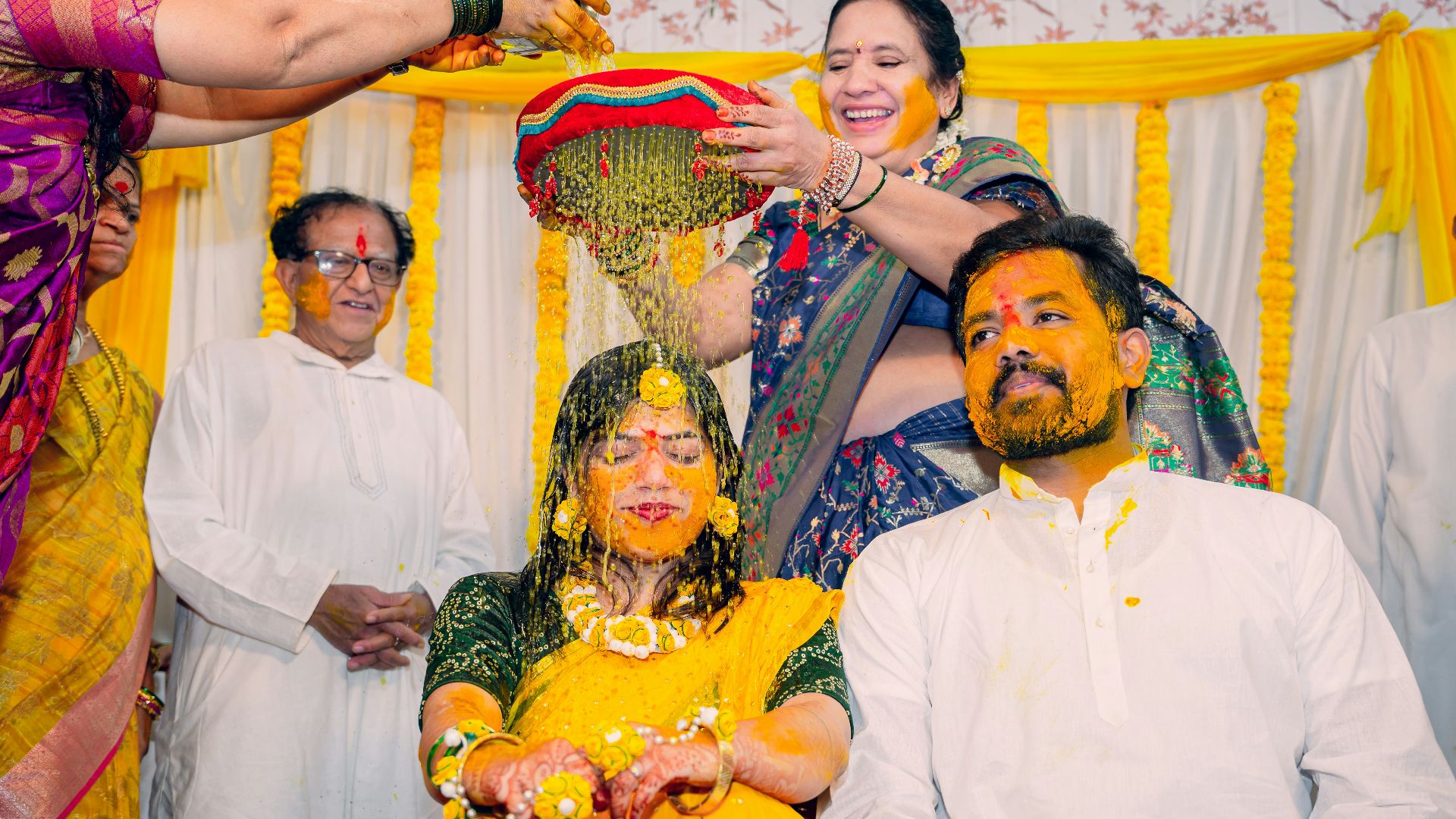 a group of people standing around each other