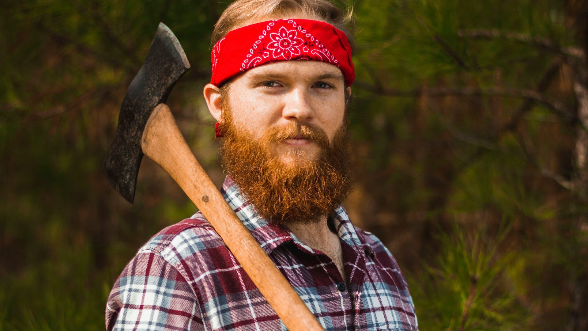 man carrying double-head axe