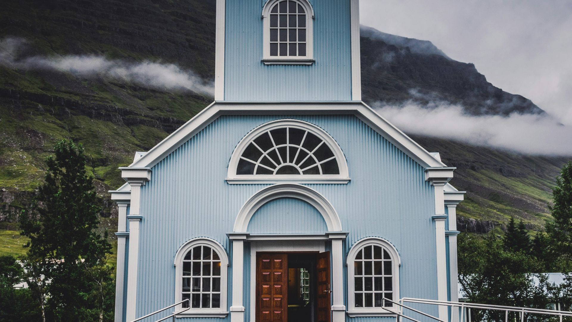 blue and white wooden church during daytime