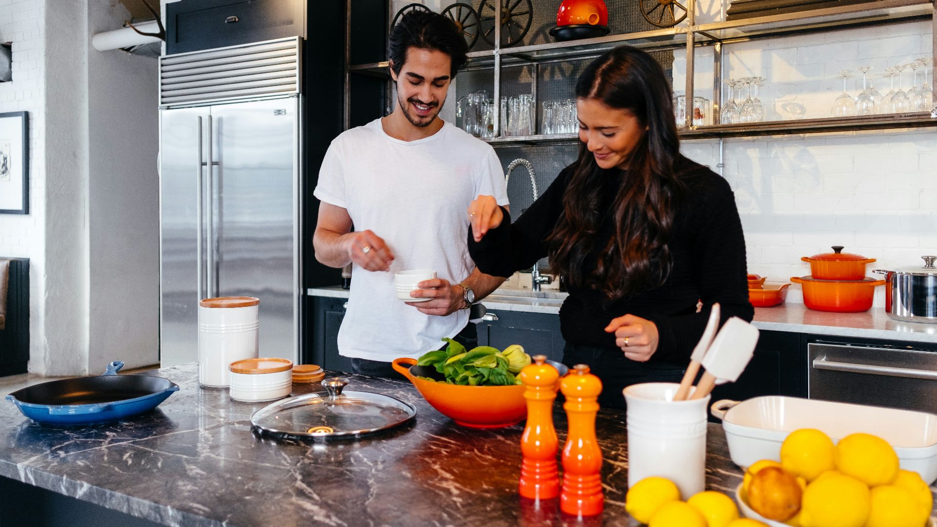 man and woman cooking