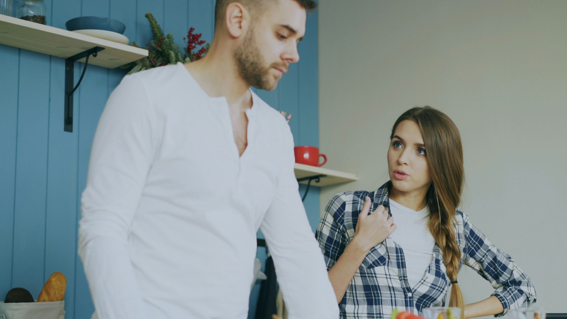Couple arguing in a kitchen