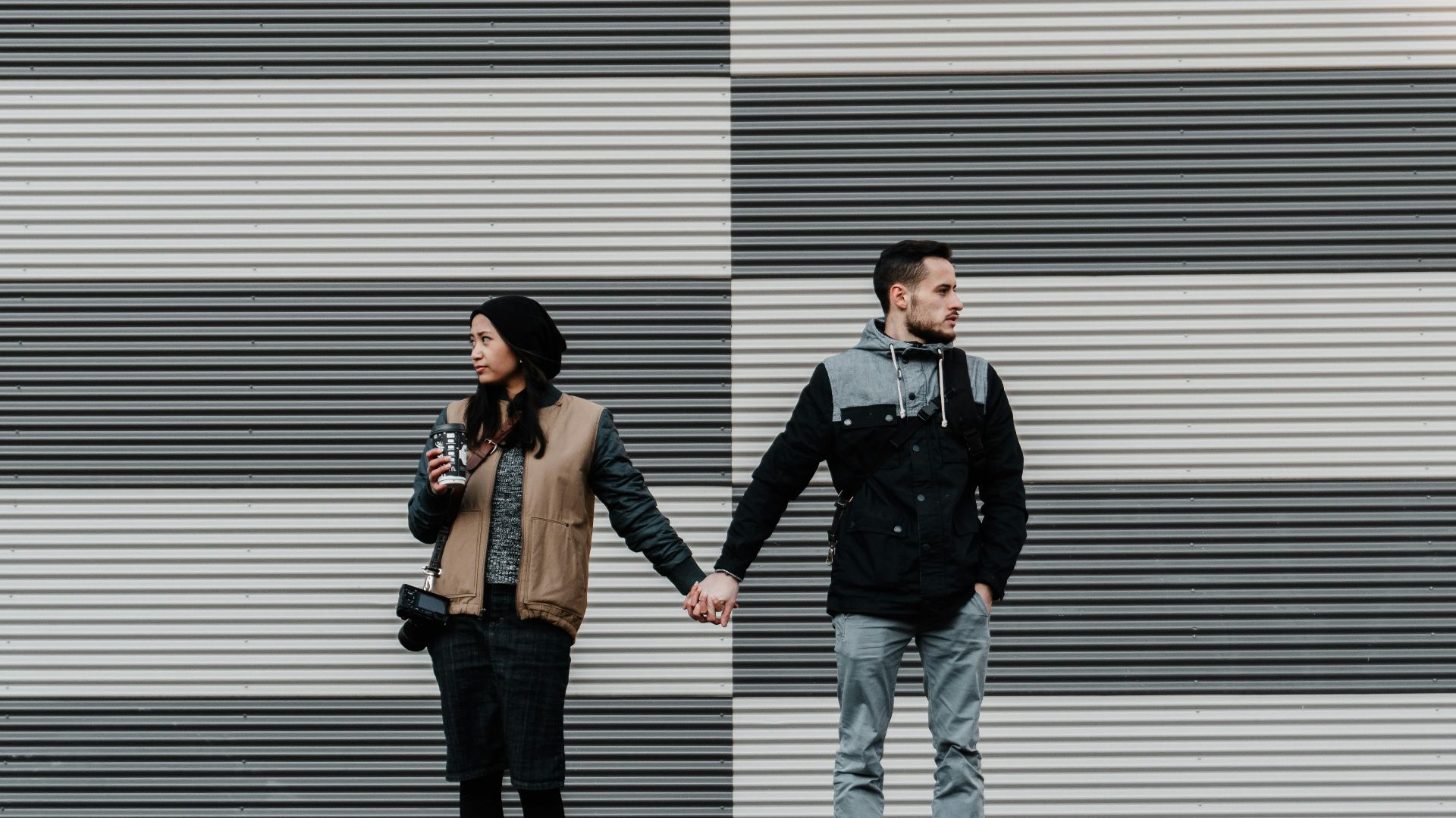 man and woman holding each other's hands