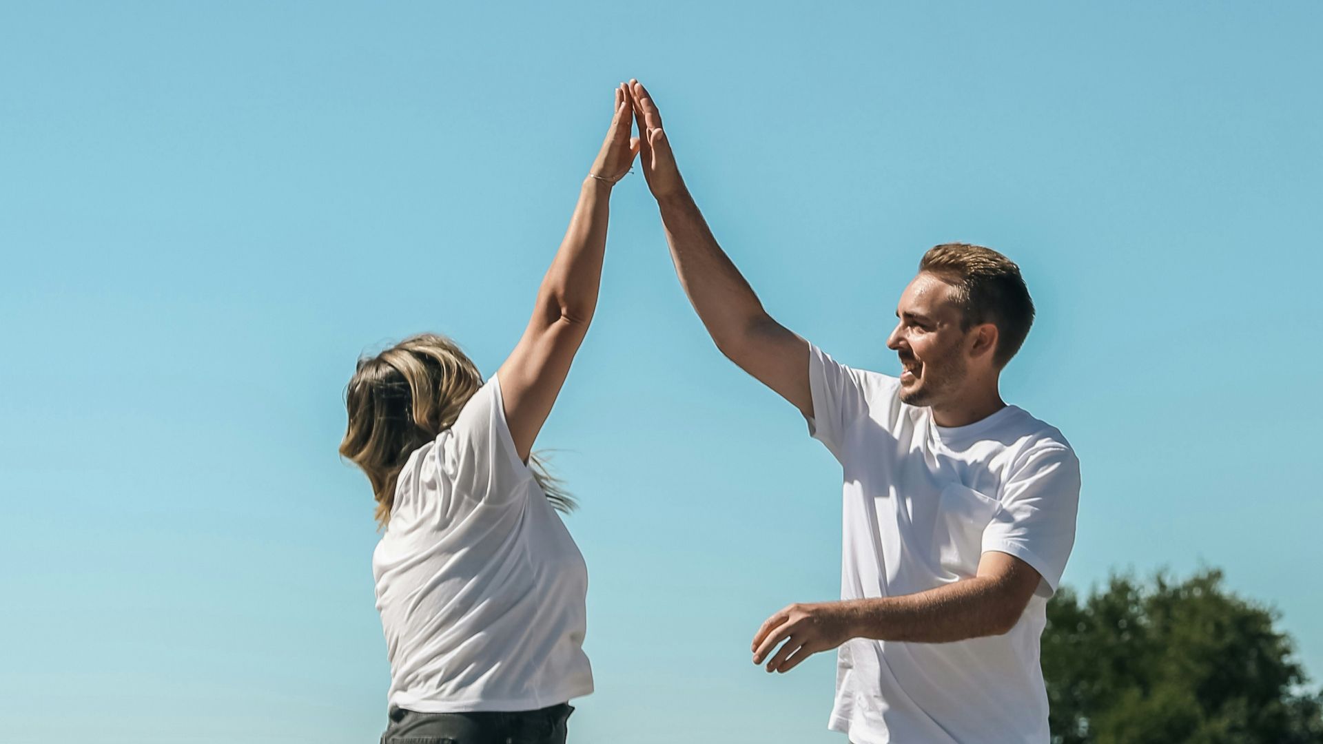 a man and a woman holding hands