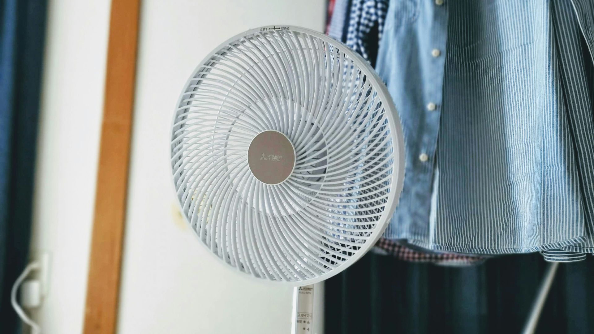 turned-on white desk fan