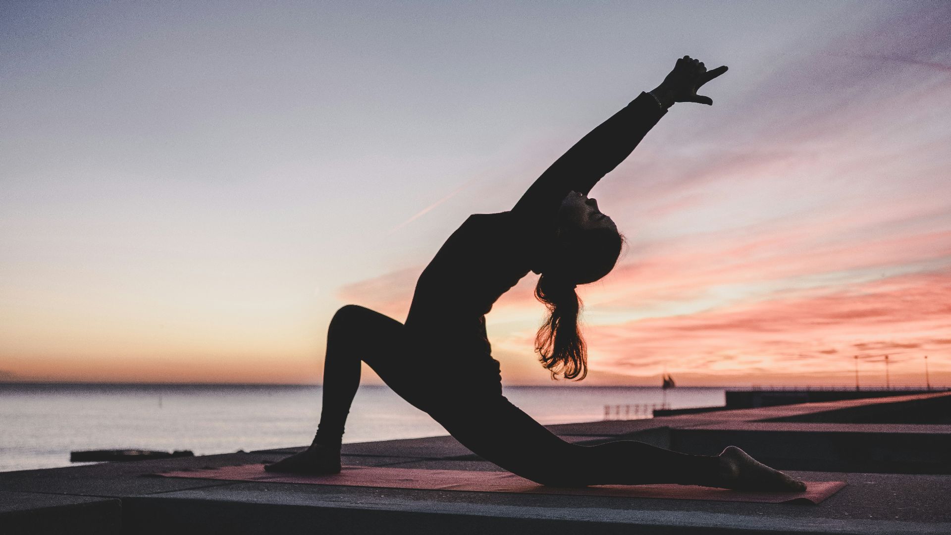 silhouette photography of woman doing yoga