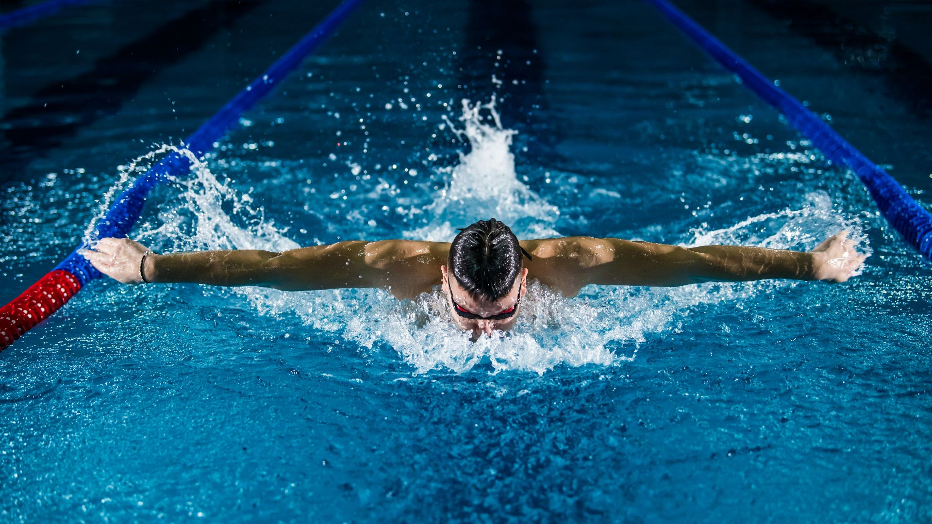 man doing butterfly stroke