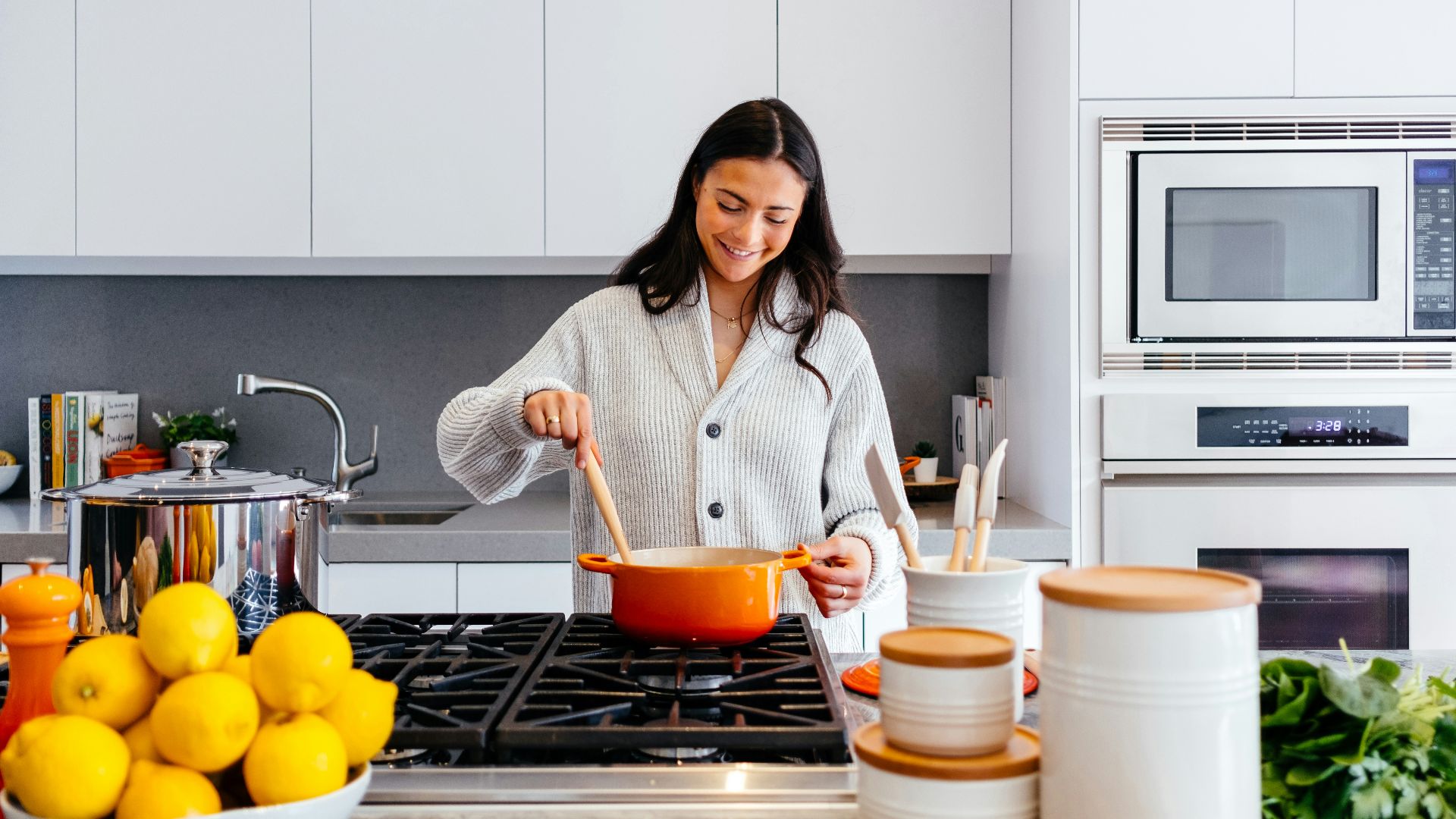 woman cooking inside kitchen room