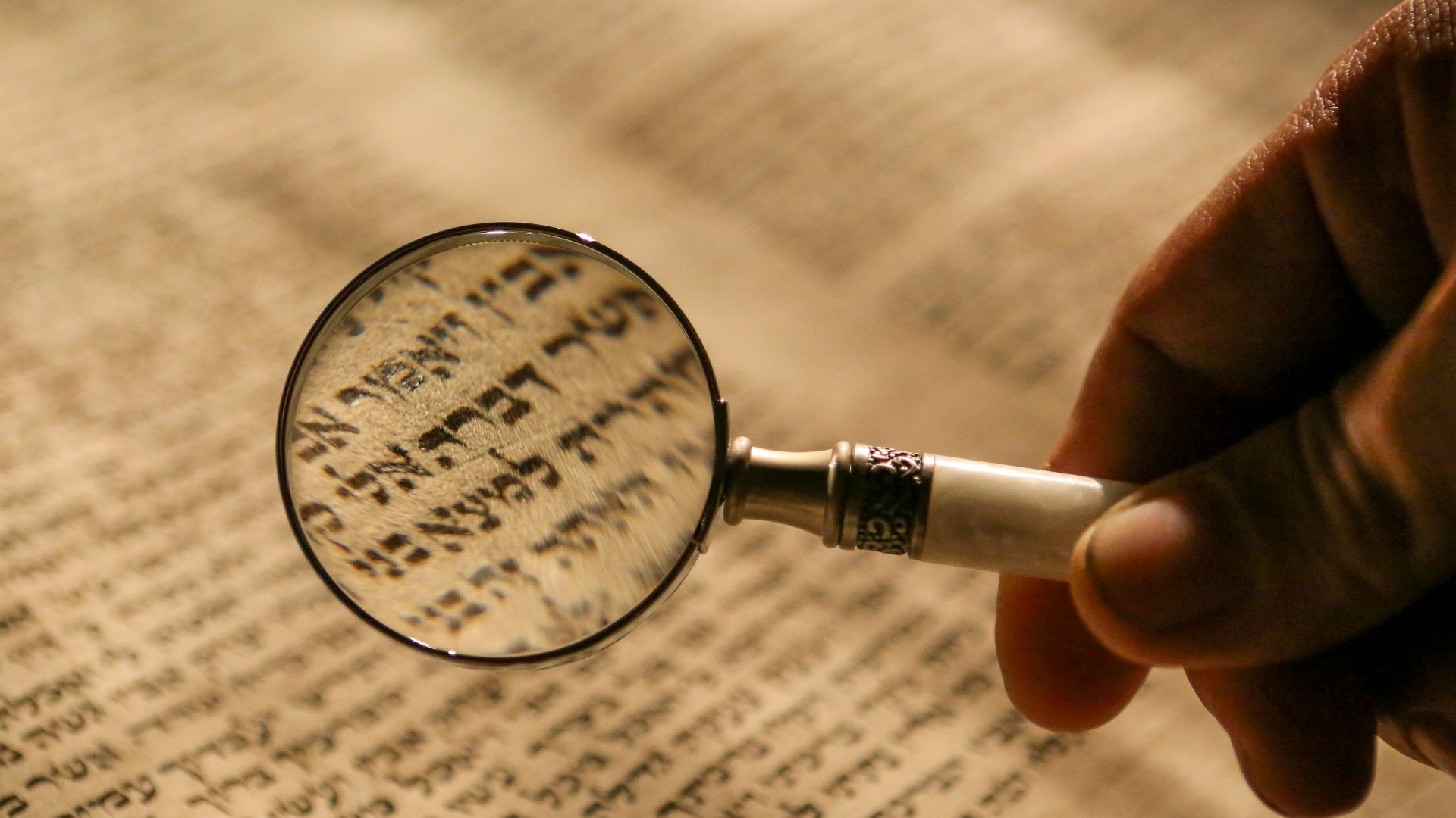 person holding magnifying glass