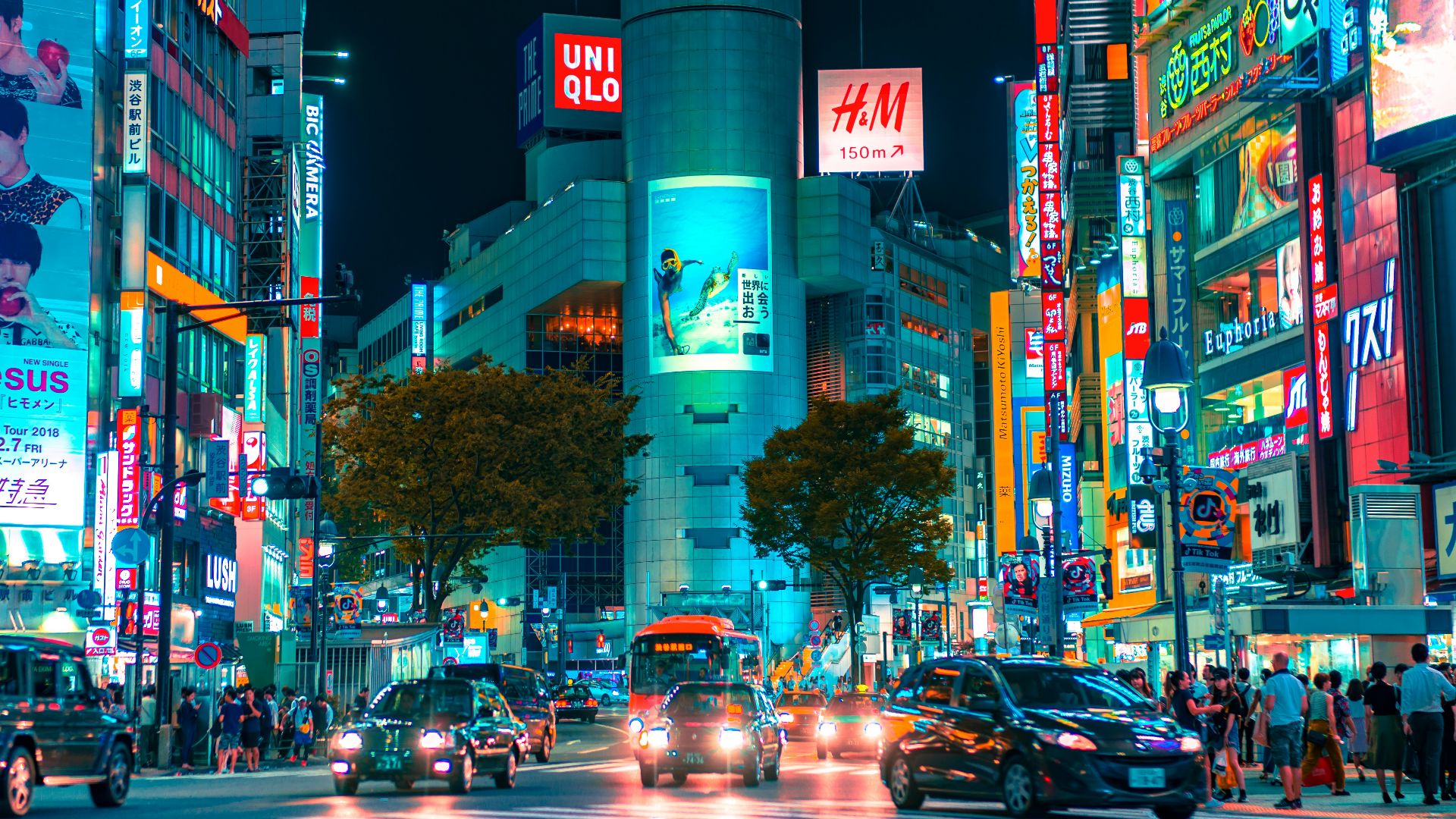 people gathered outside buildings and vehicles