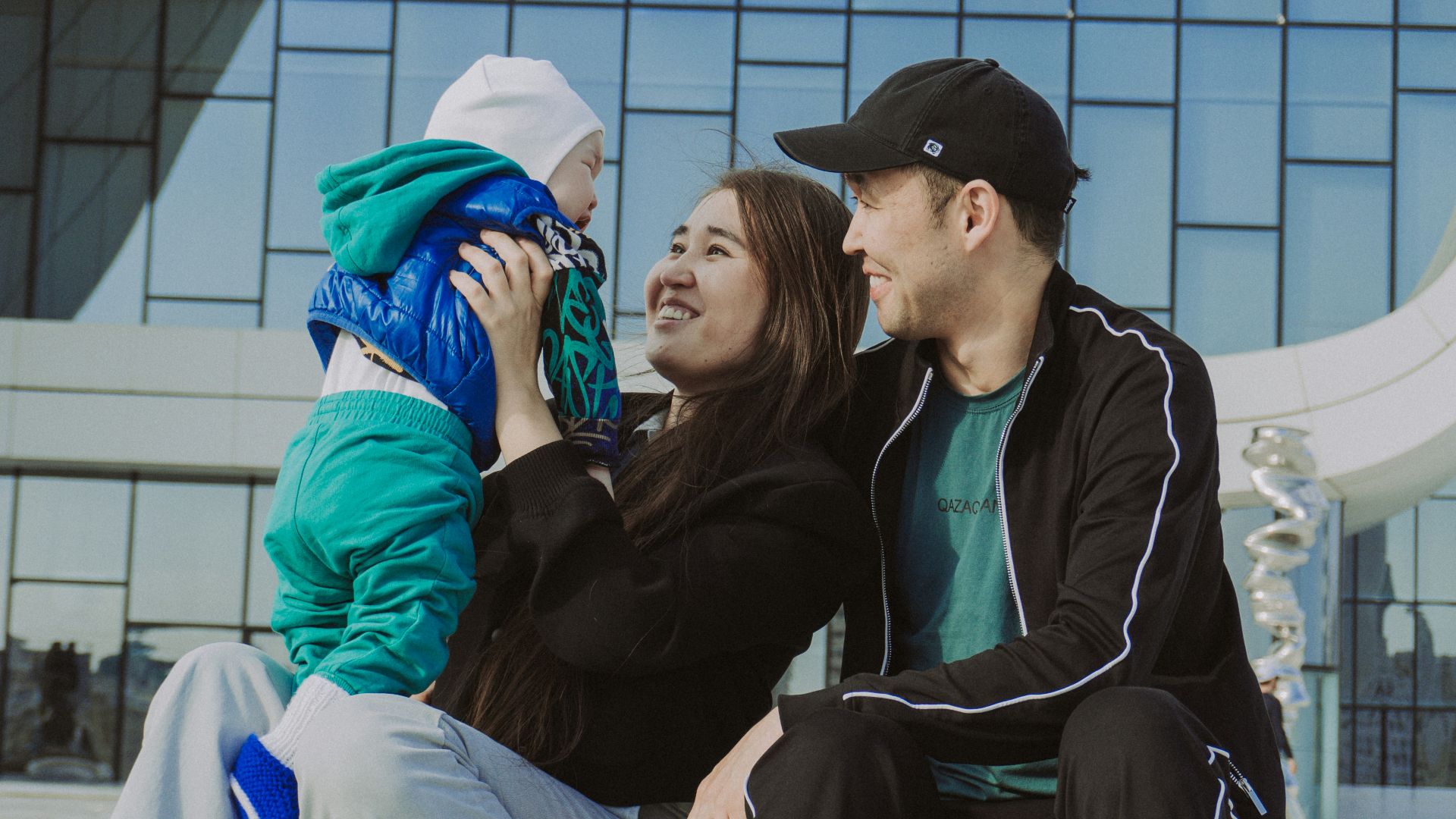 A family is spending time together outdoors.
