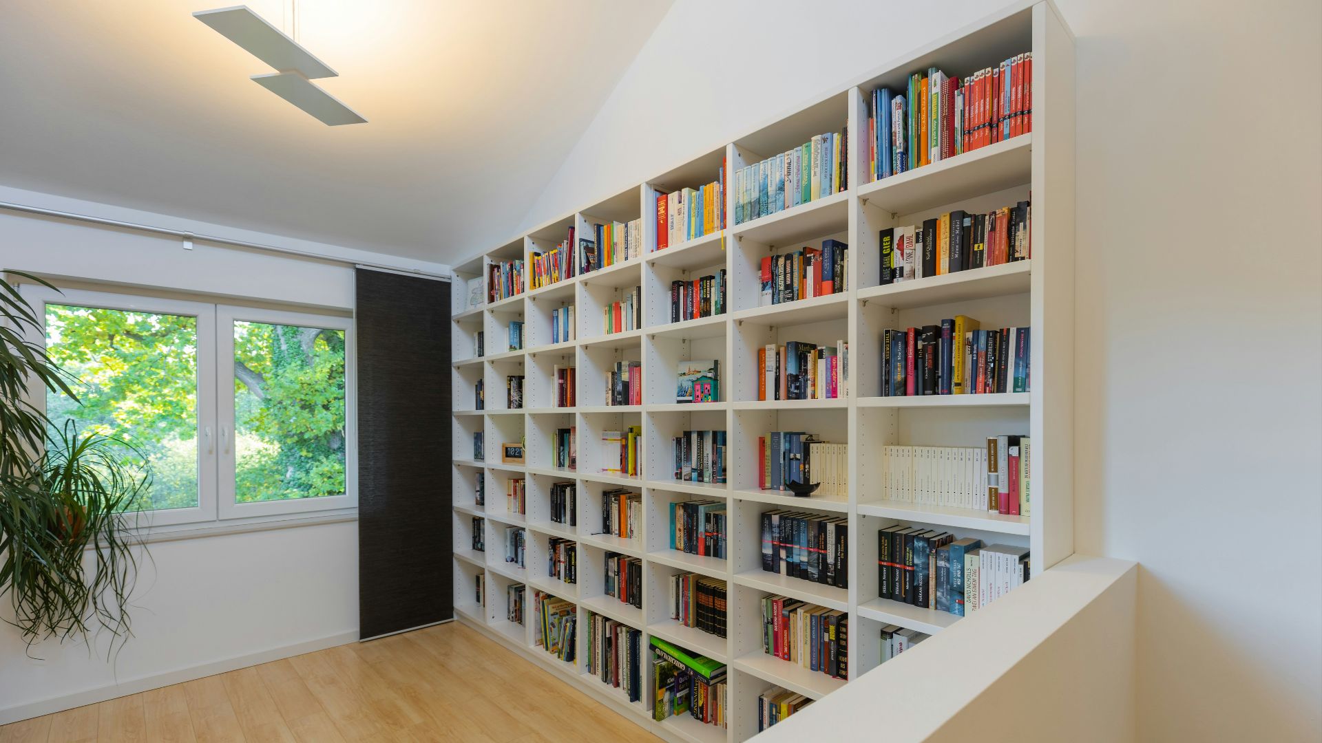 books on brown wooden shelf