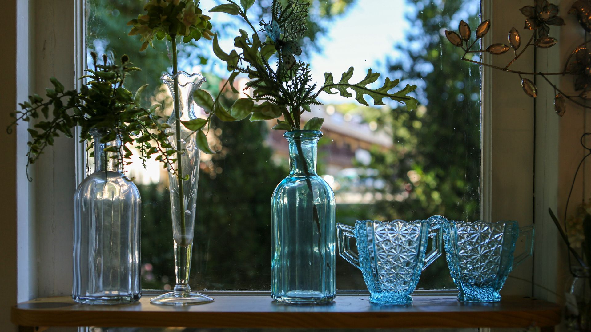 blue and white floral ceramic vase on brown wooden table