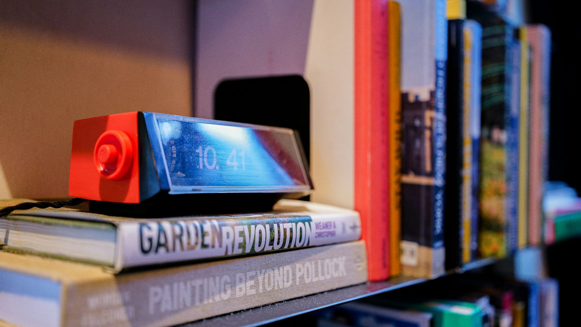 a stack of books sitting on top of a shelf