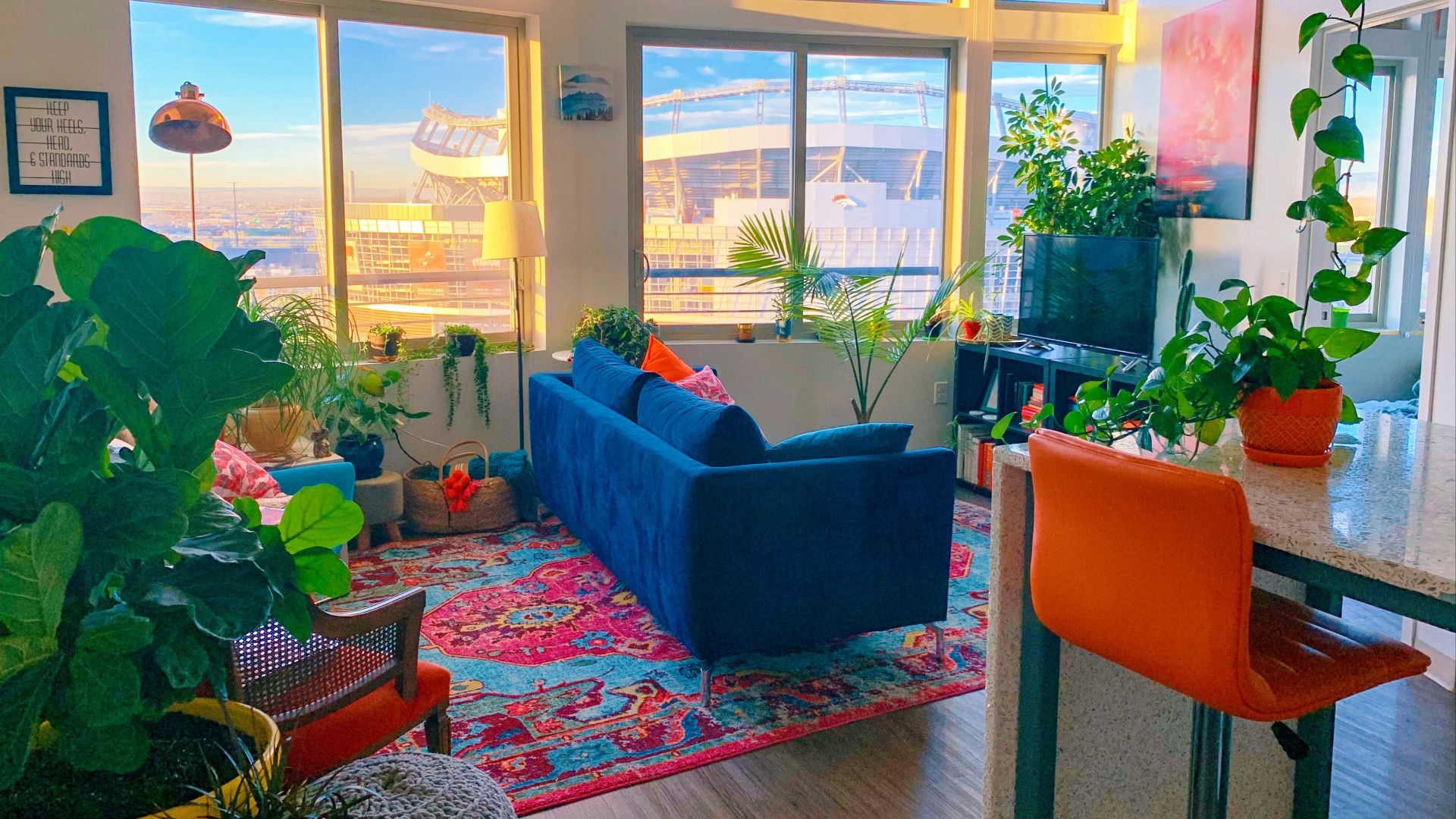 a living room filled with furniture and lots of windows