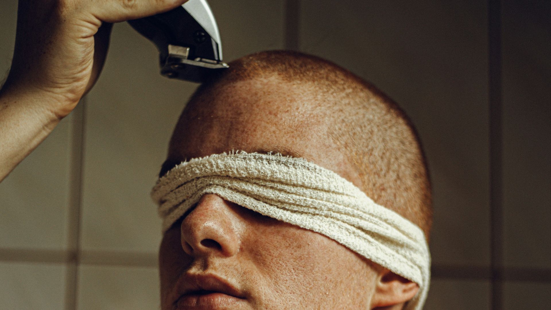 a man with a bandage around his head