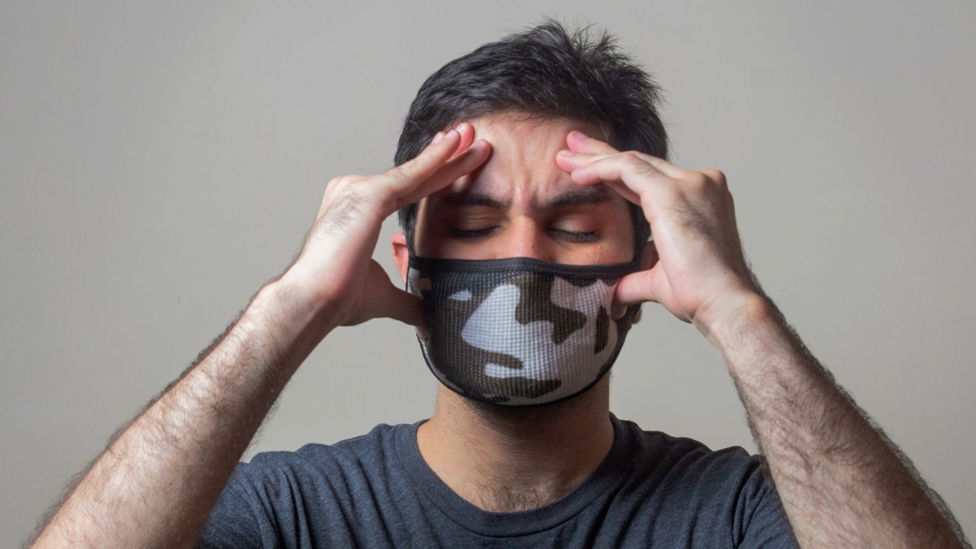 man in black crew neck t-shirt wearing black and white mask