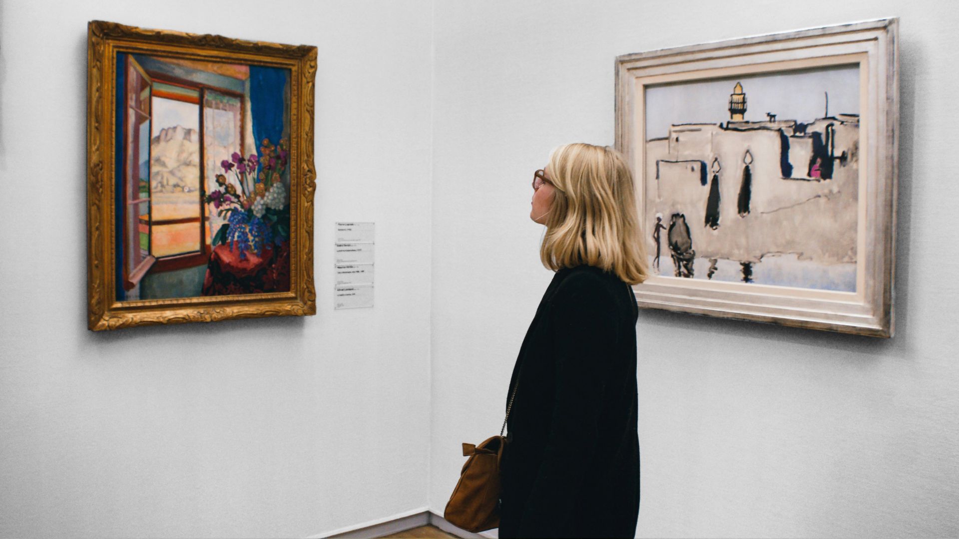 woman looking at painting