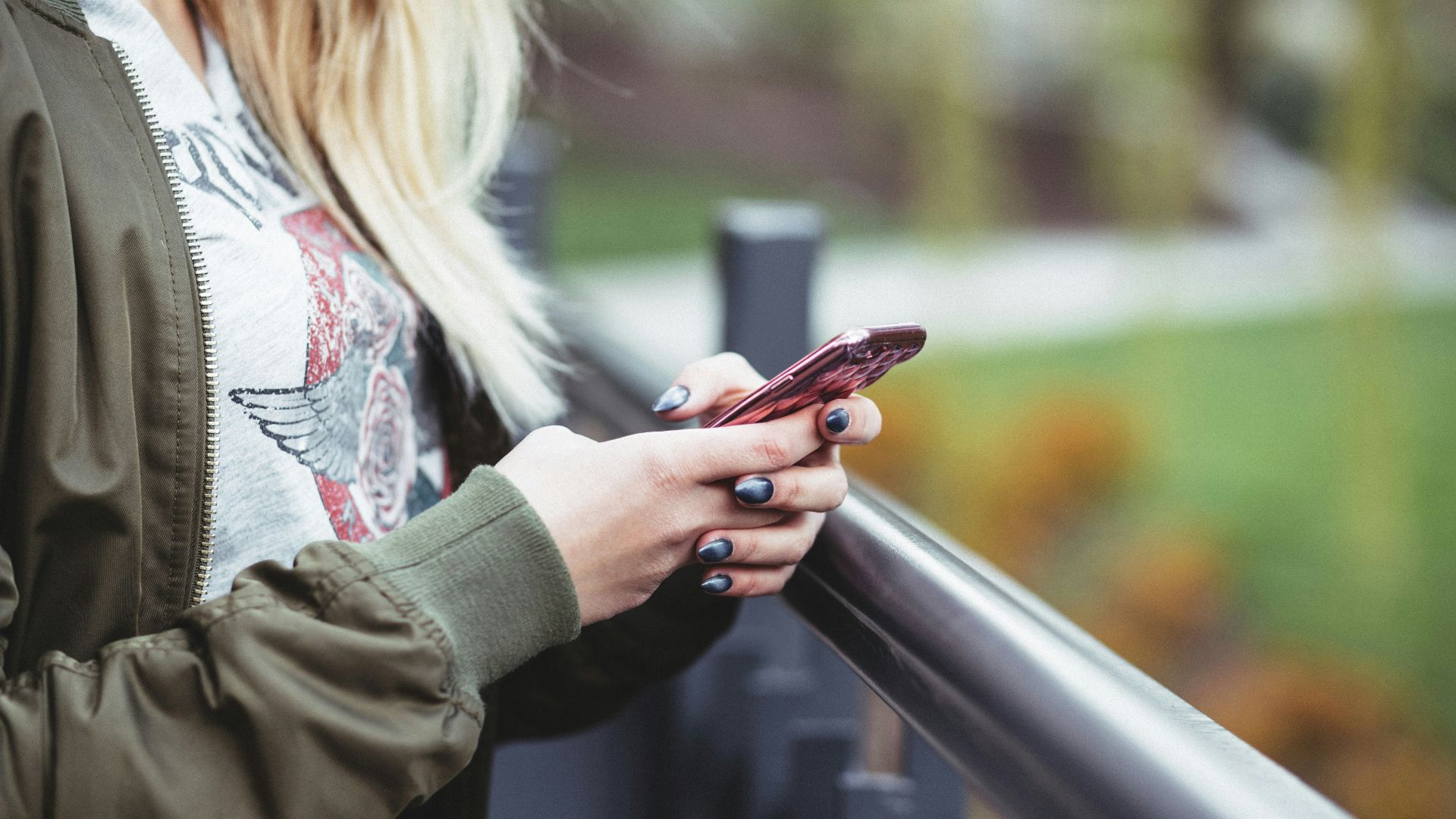 woman holding red phone