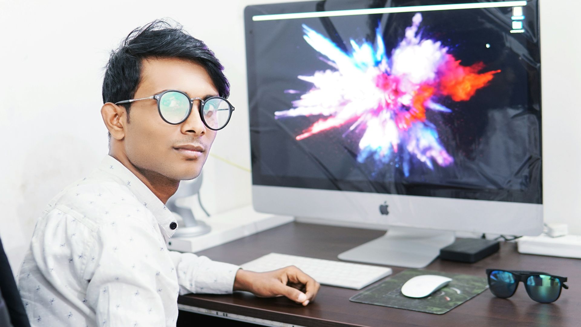 man using iMac