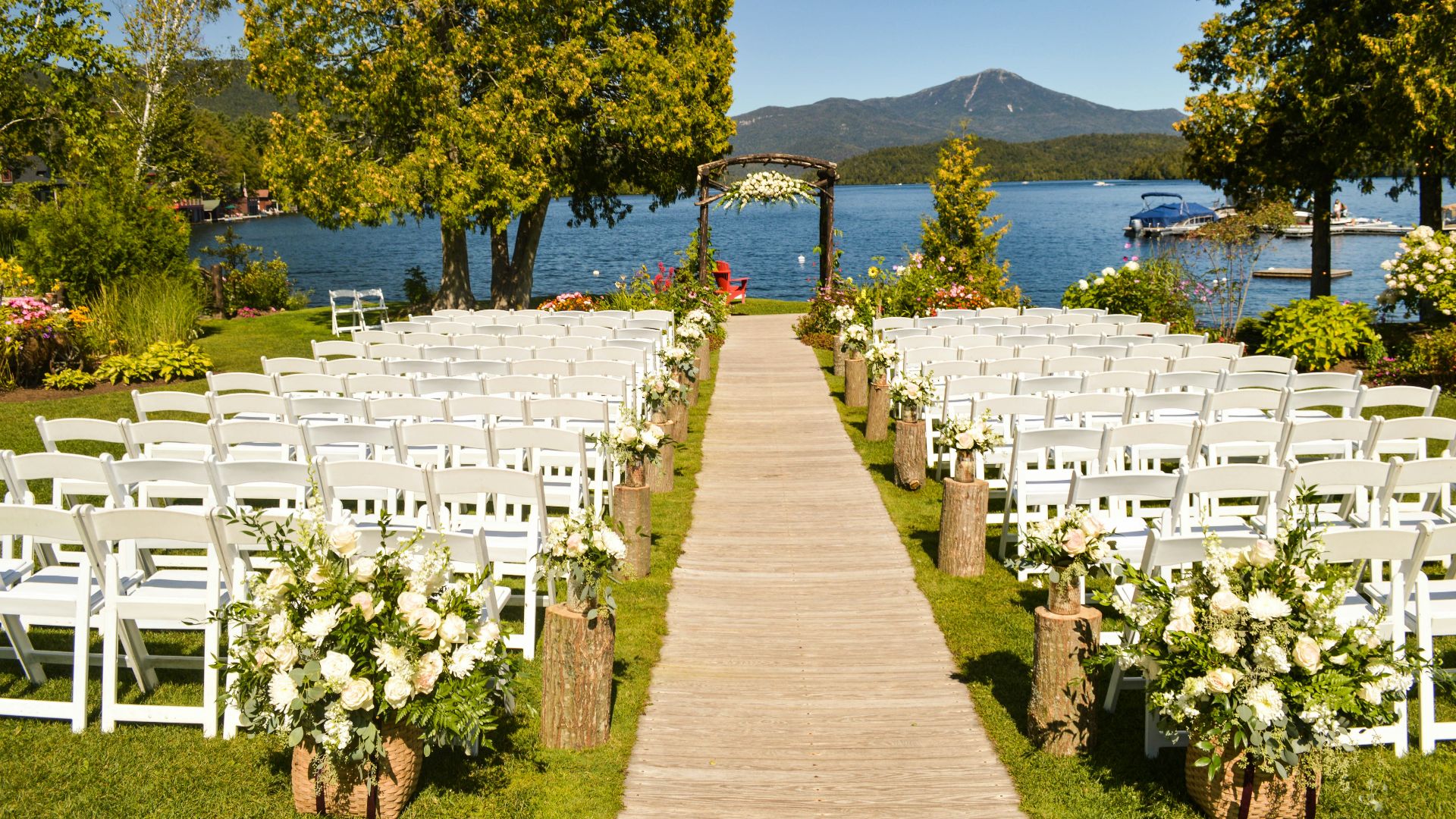 white folding chair in front of body of water