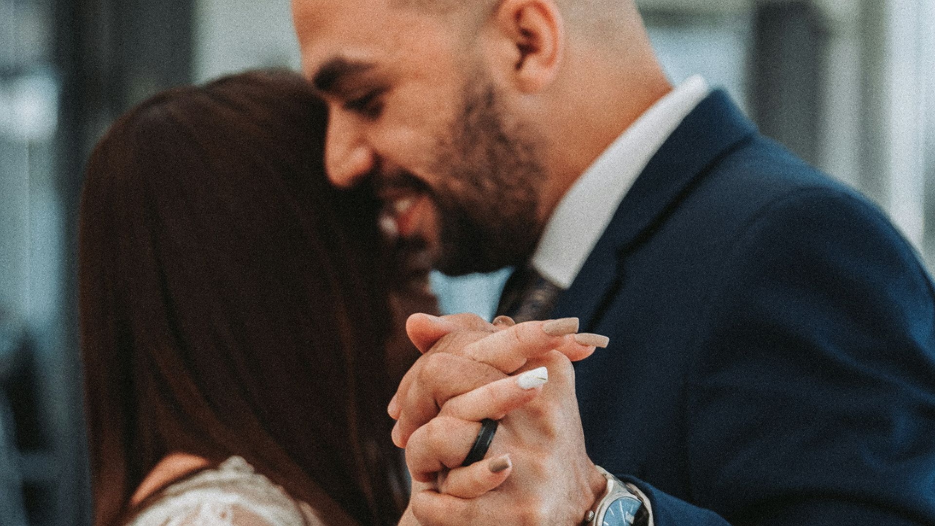 a bride and groom dance together at their wedding