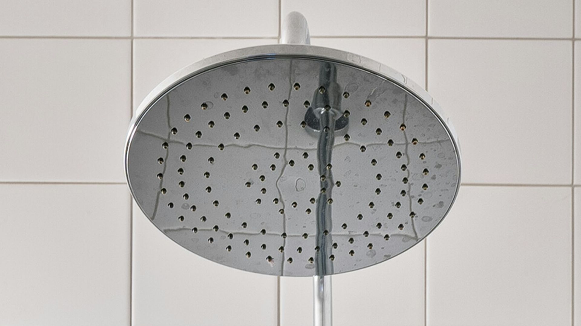 A walk in shower sitting next to a shower head