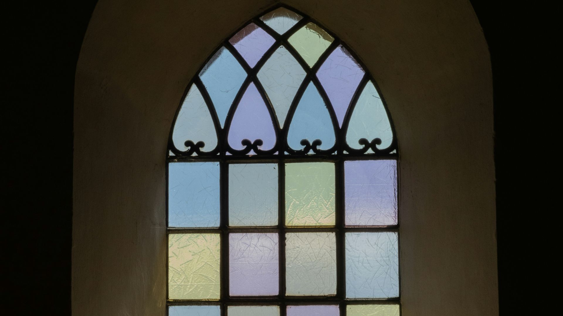 a window with a view of the sun through it