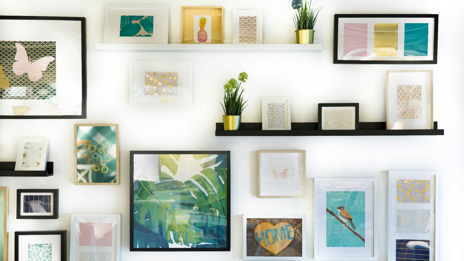 assorted-color framed paintings on the wall