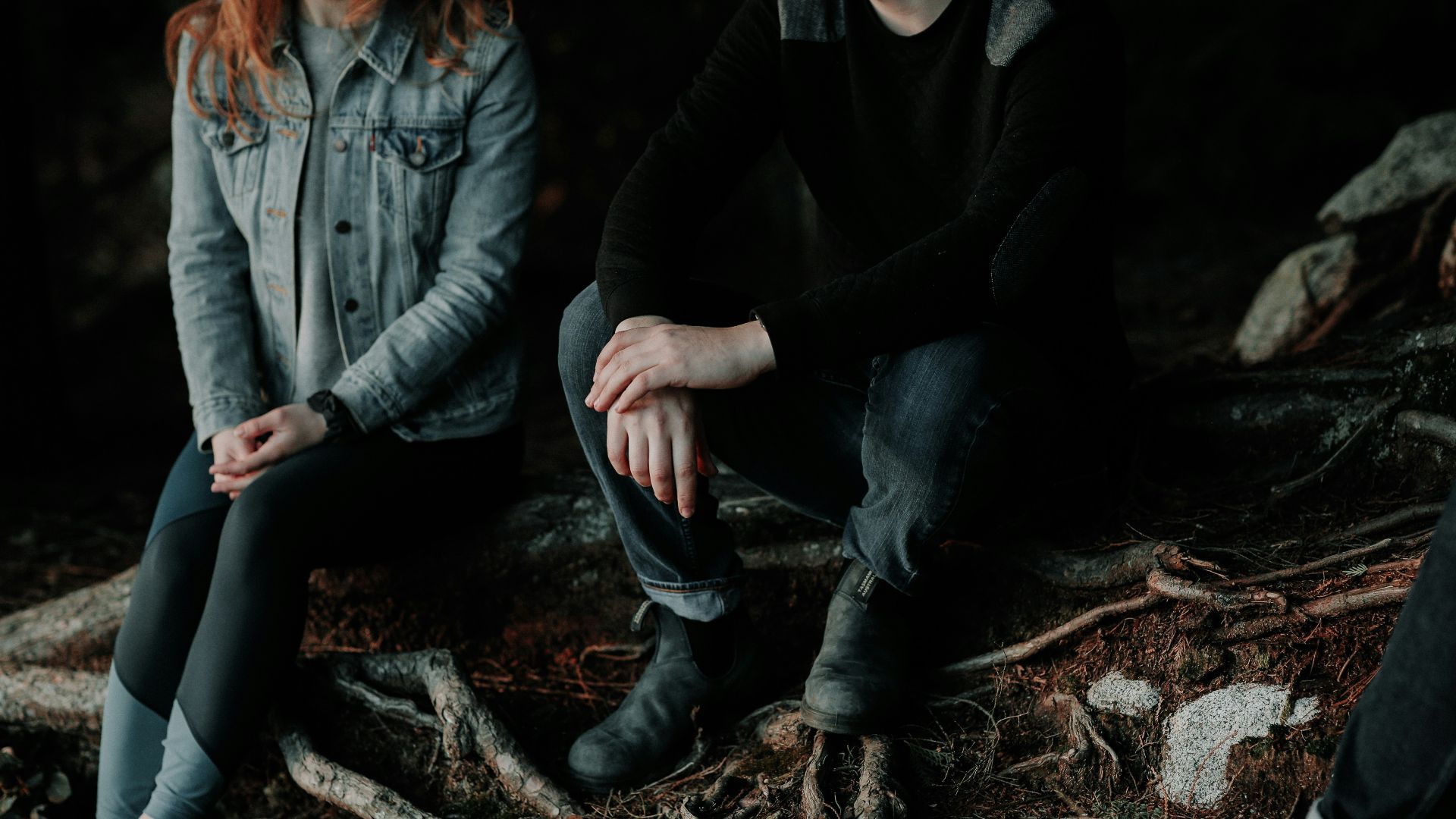two person sitting on wood slab