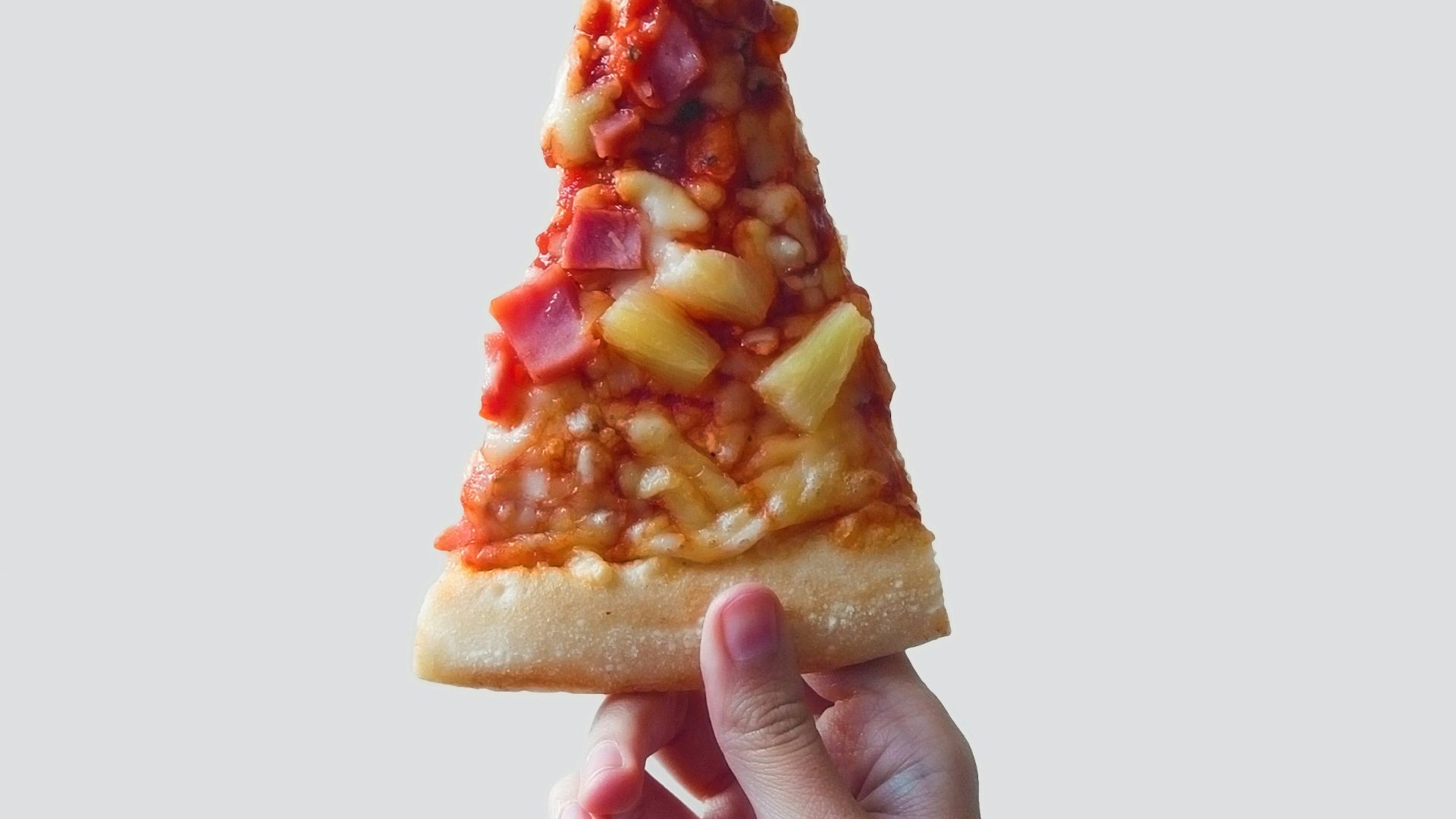 person holding sliced pizza